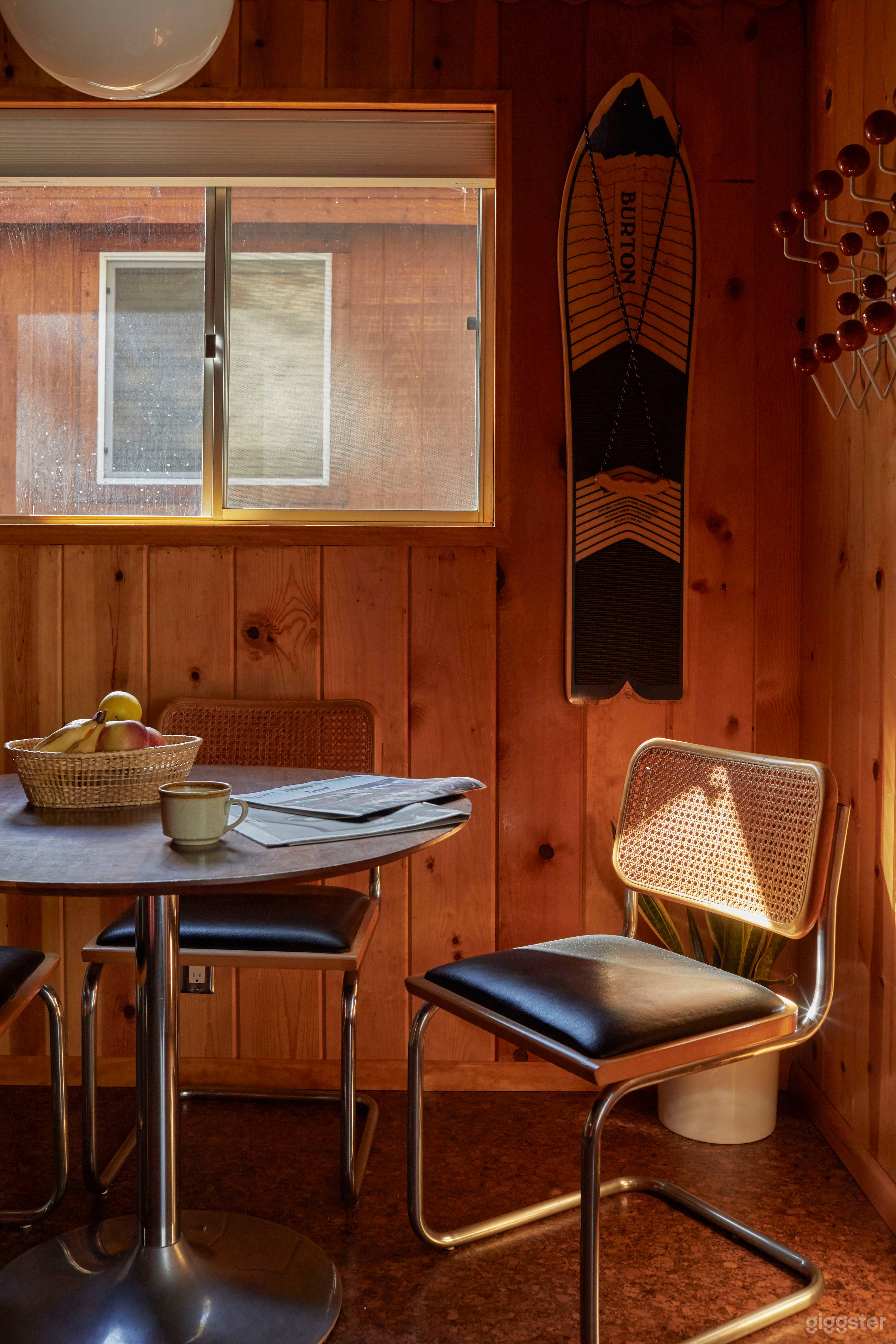 Mid Century cabin with fireplace in the middle.  Photo 4