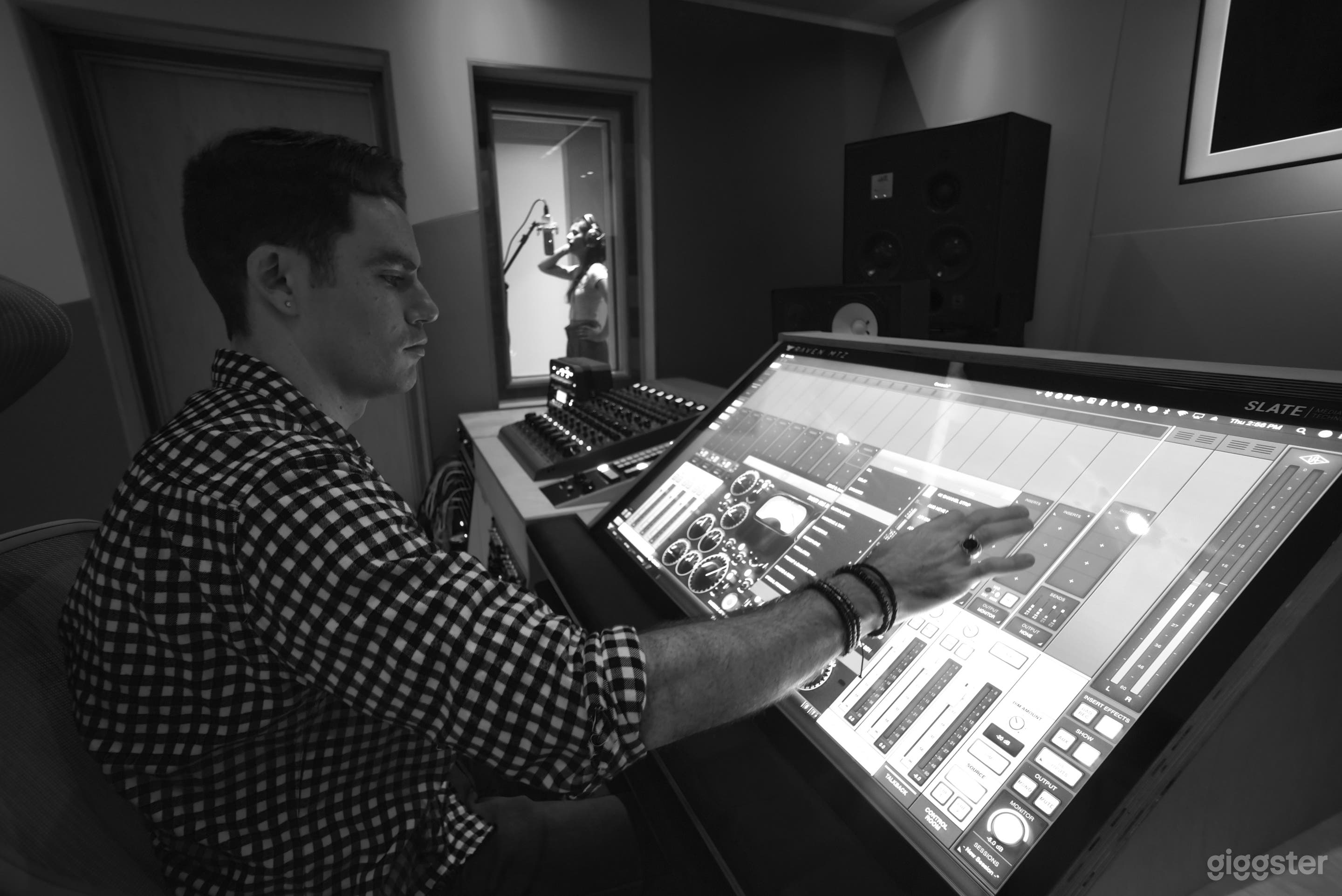 Control room desk to iso booth view.