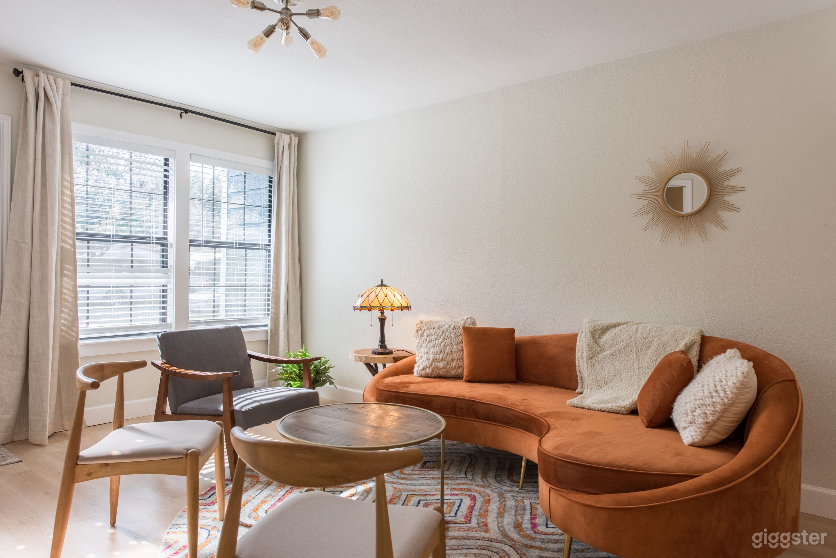 Two large living rooms, great for interviews. Shades can be pulled for light control. 