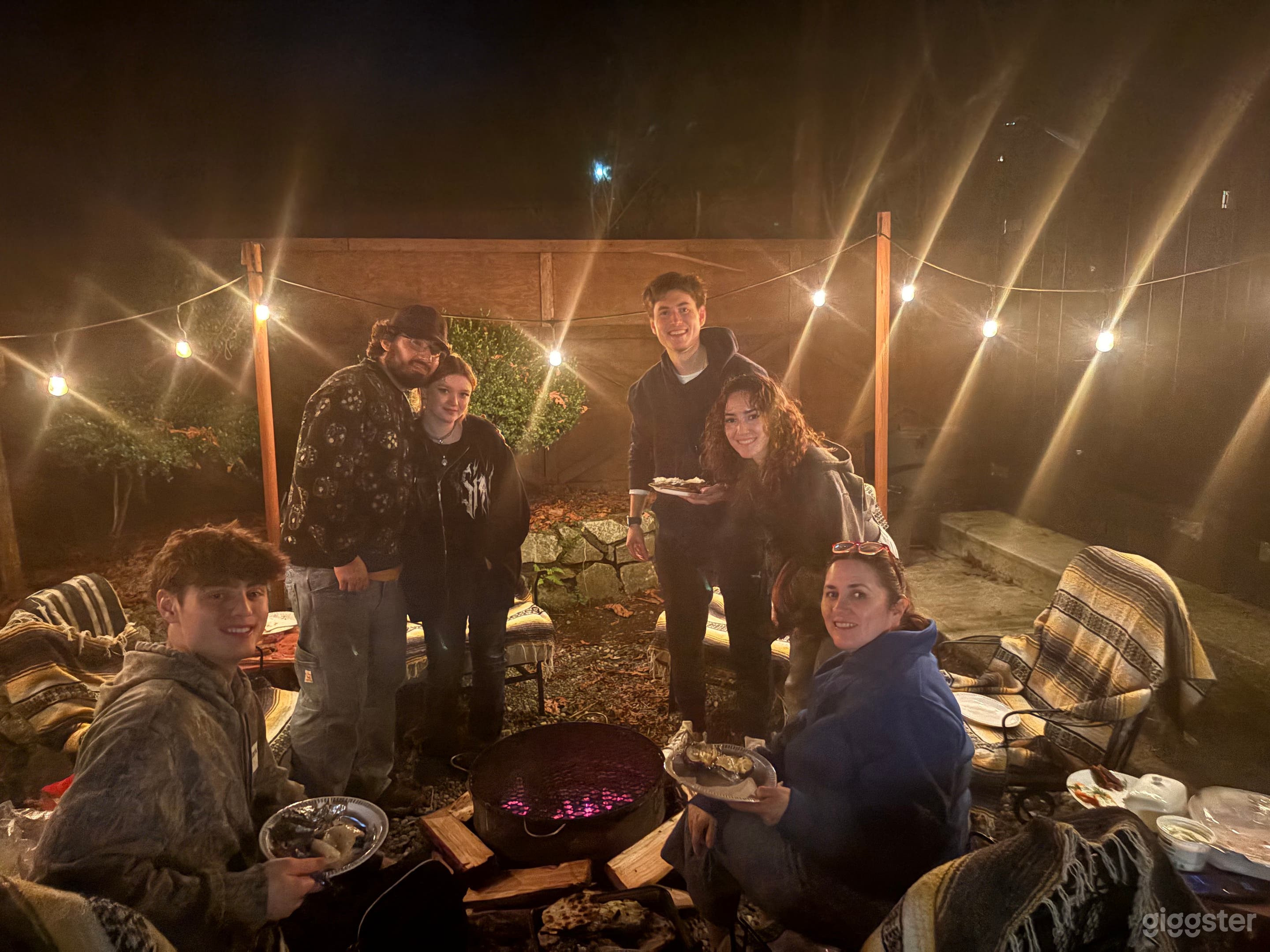 Charming Outdoor Firepit Lounge with Rustic Vibes Photo 3
