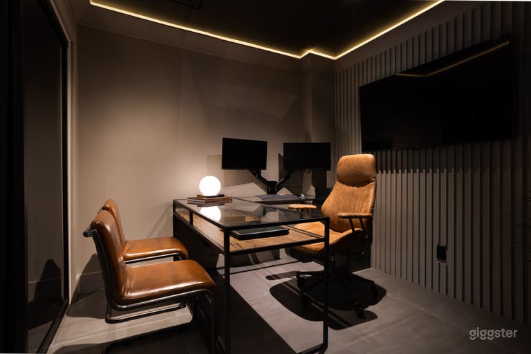  Home office 2. Located on basement level. Enclosed with smoked glass sliding doors. 