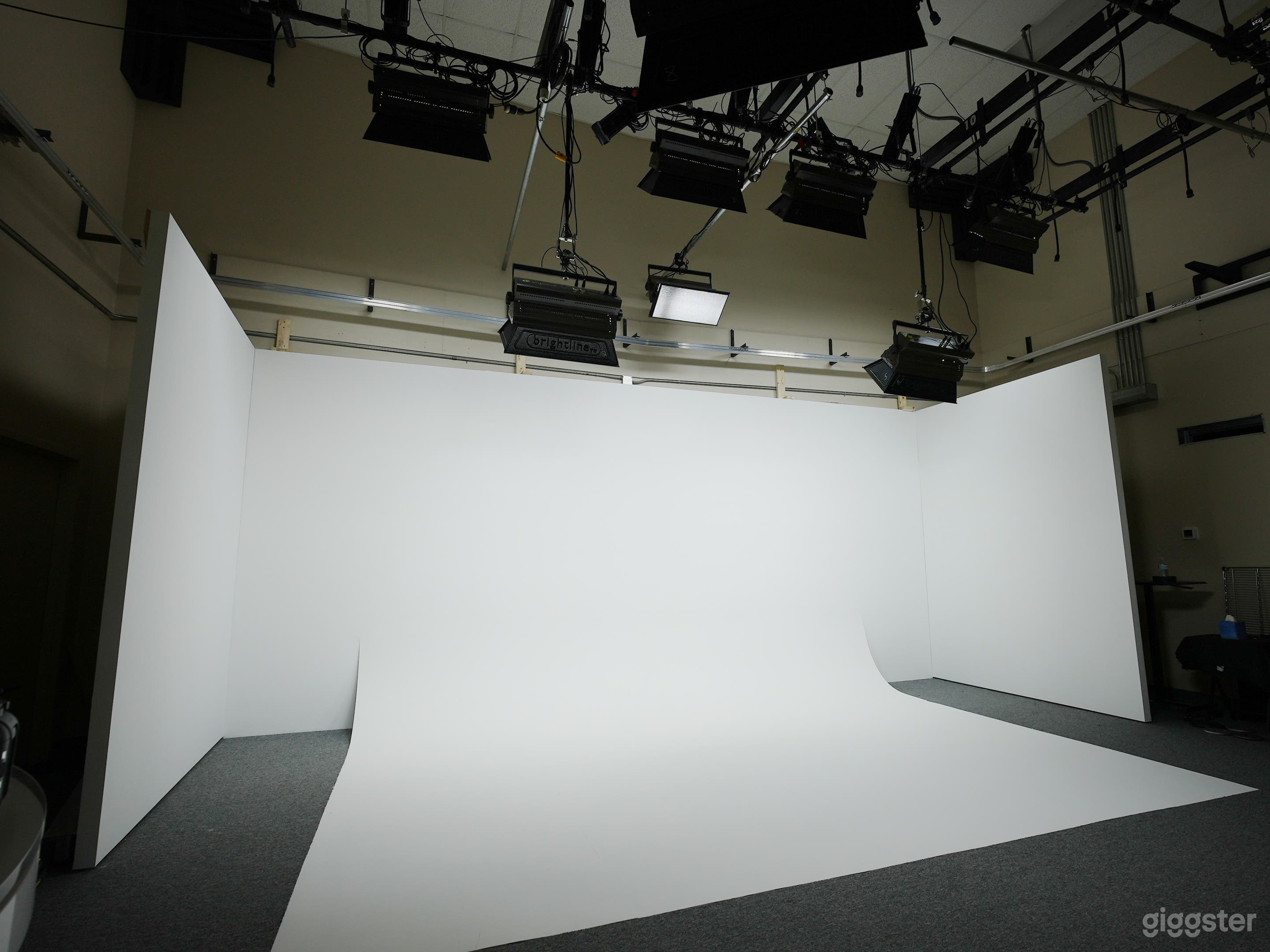 Cyc wall and lighting grid at our video production studio in Tallahassee