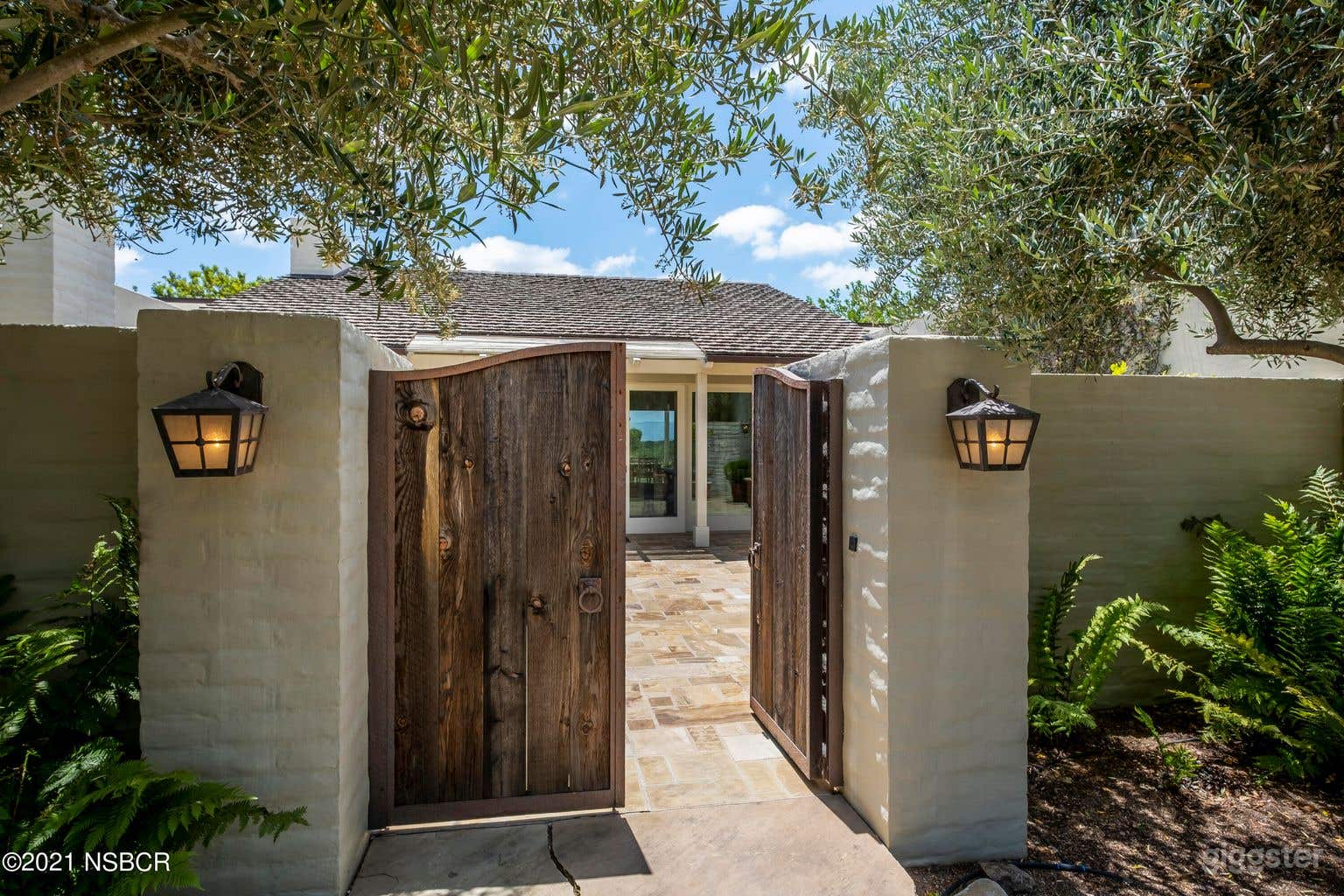 View from the driveway to the front door/gate.