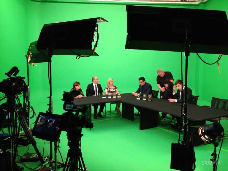  Panel discussion over green screen 