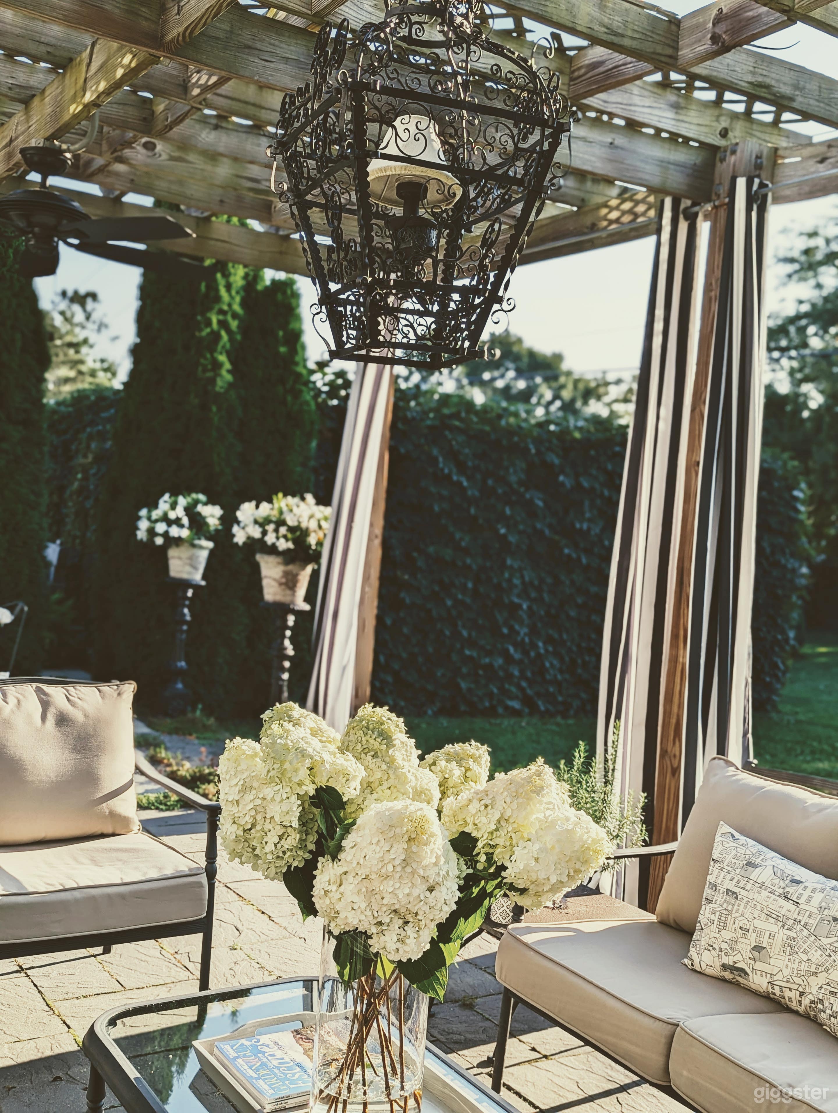 One-acre property in Hudson, NY: Remodeled Executive Cape home, 12' x 24' pergola, ivy covered walls enclosing a 20' x 16' "garden room", vegetable/flower garden and garden shed that also functions as outdoor dining room. Entire property enclosed by fence.