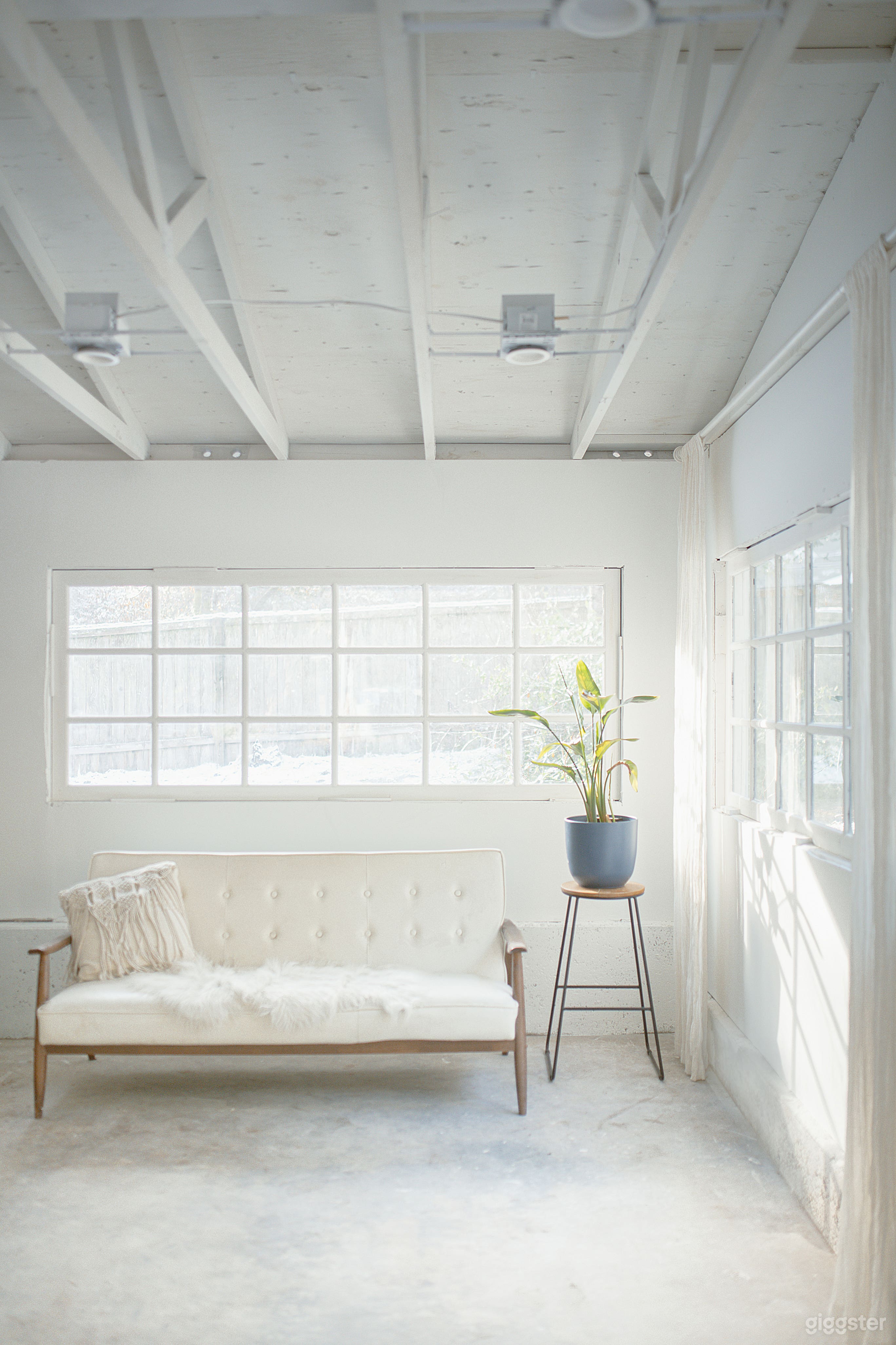 White mid-century sofa &amp; industrial stool available to use