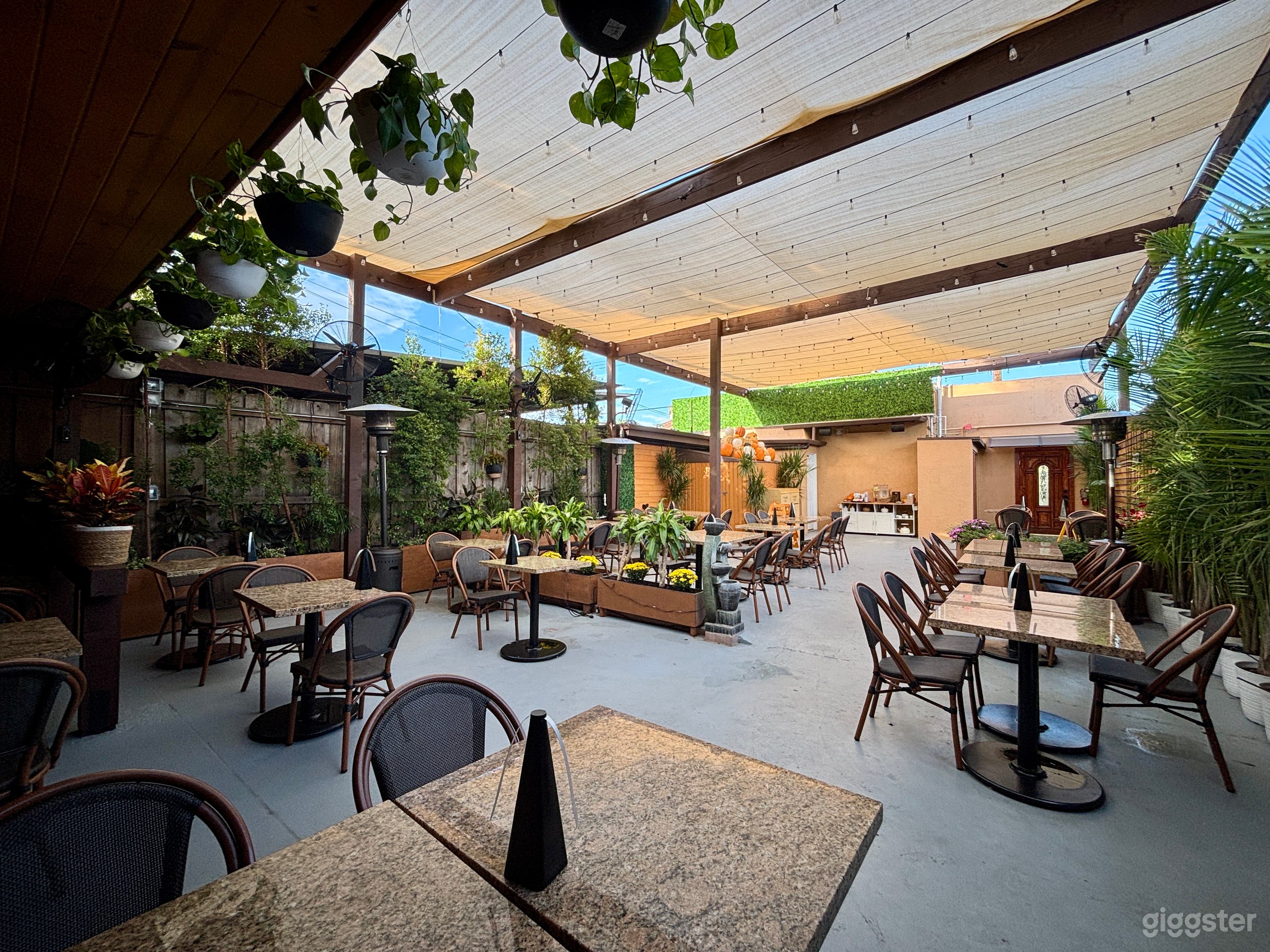 French Coffee Shop and Patio with lush greenery Photo 1