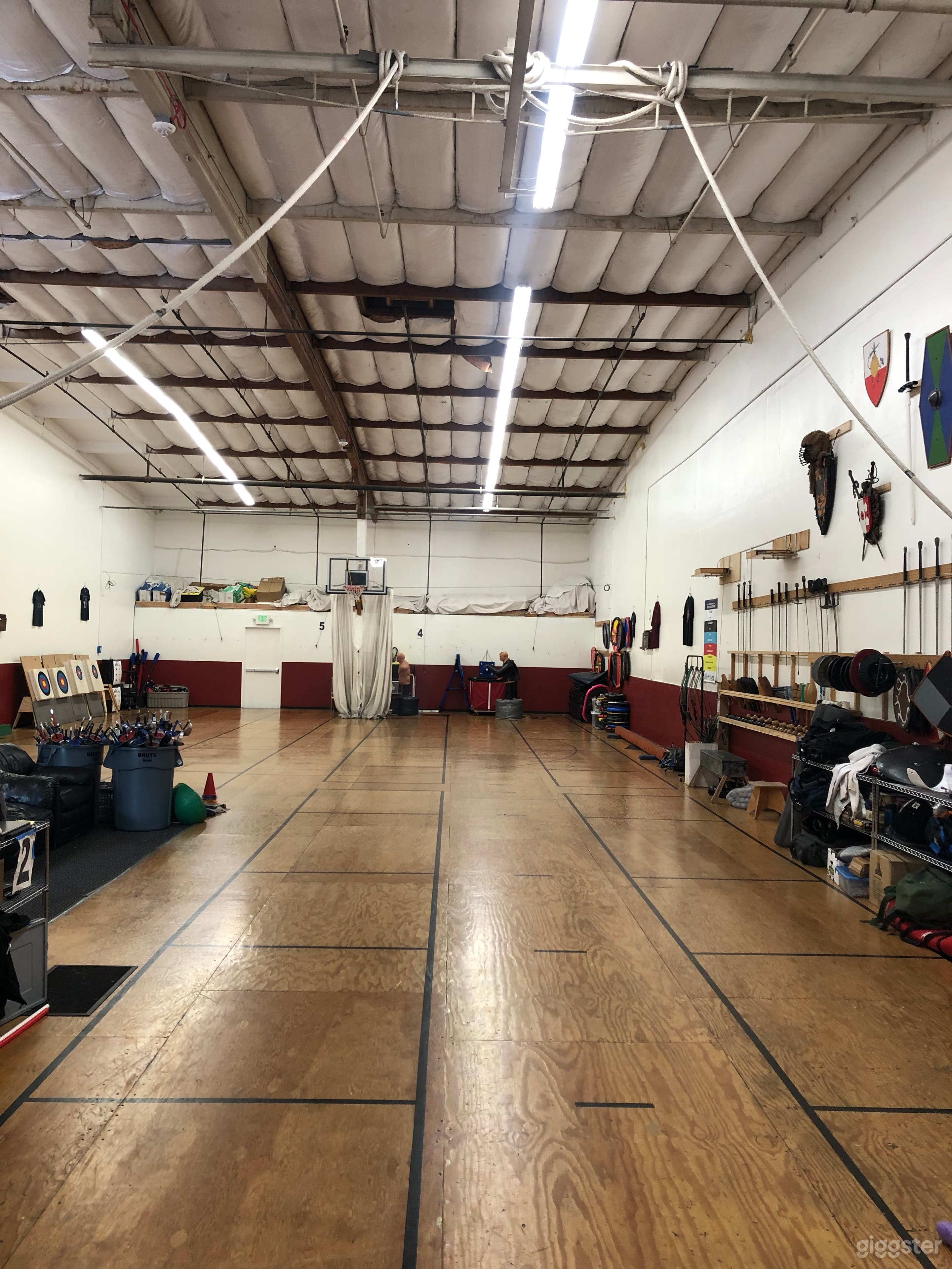 EGF interior shot, near roll-up door. High ceilings, brightly lit with LED lights. 