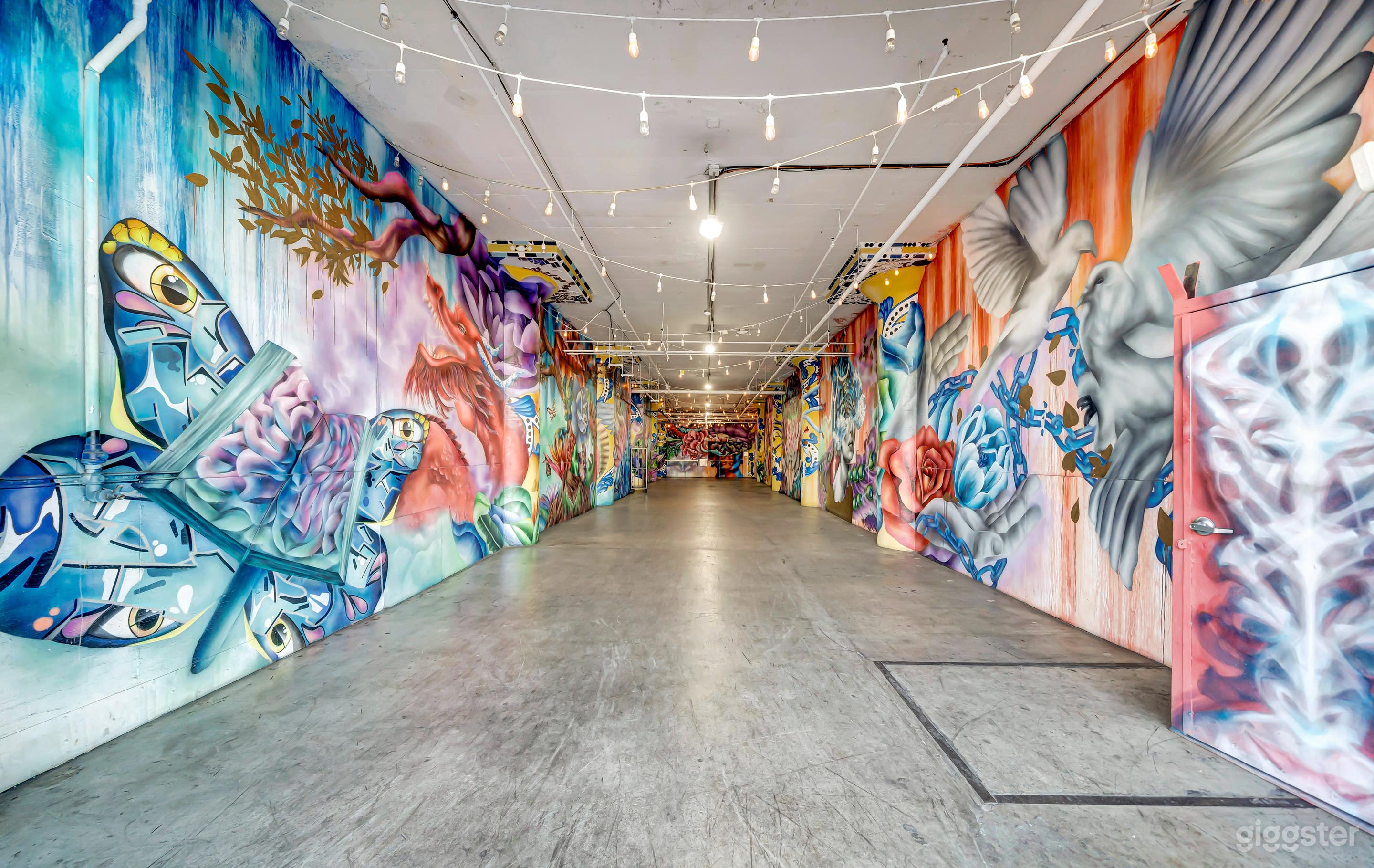 Immersive Corridor w/ Floor-to-Ceiling Murals Photo 2