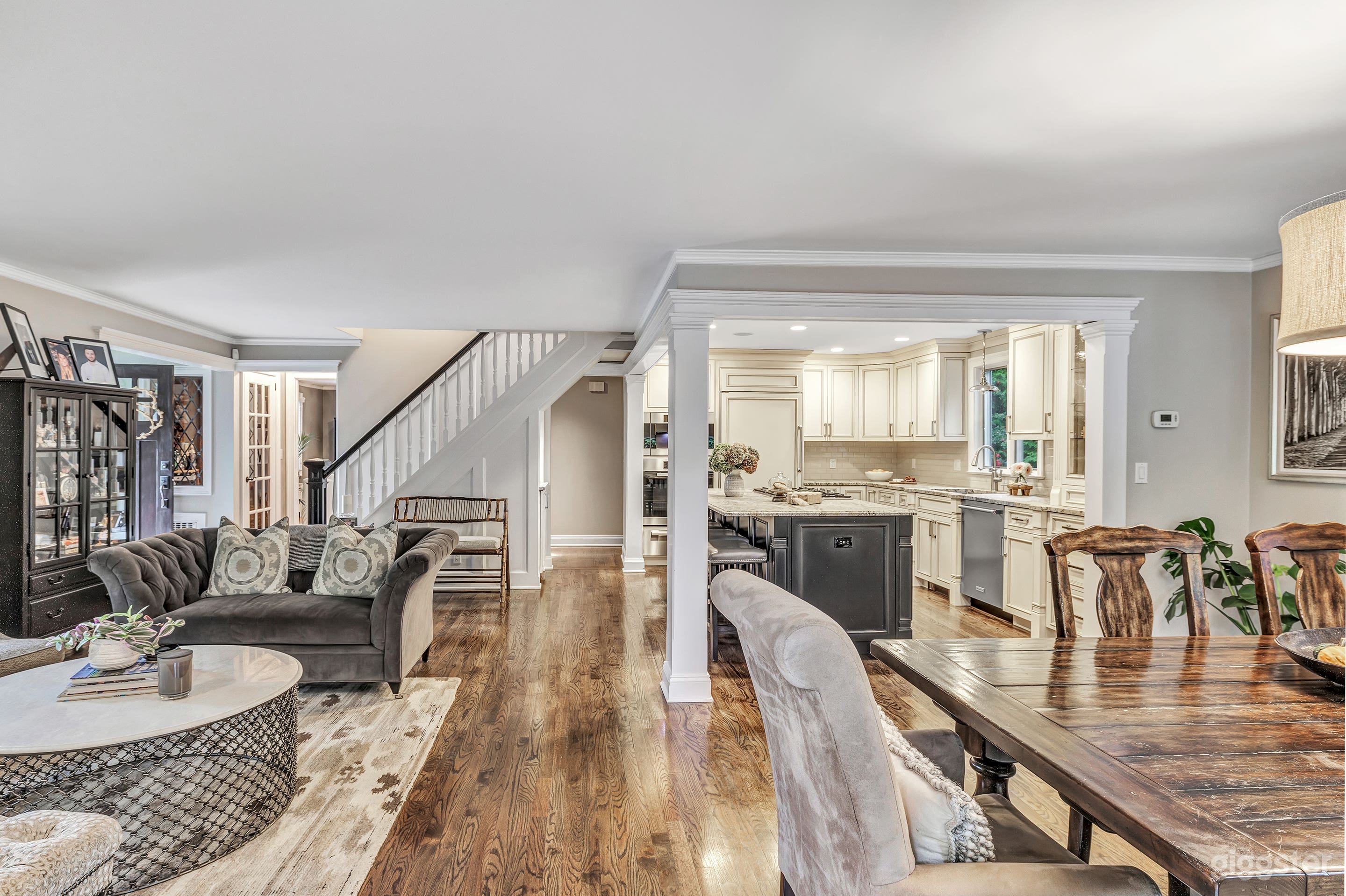 Open concept kitchen/dining and formal living area when walking from pool/bar room.