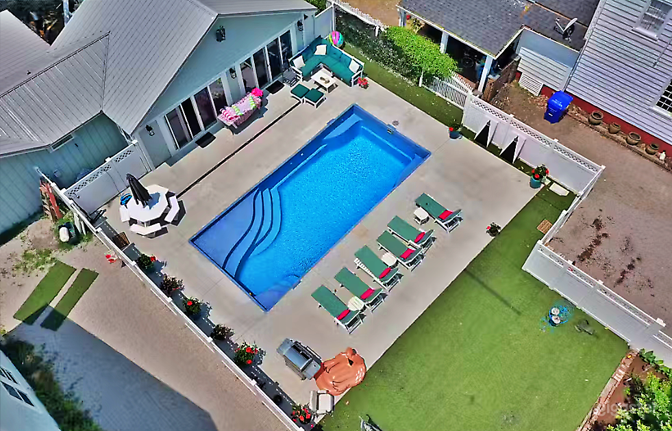 Radiant Rectangle Pool with Lawn Photo 1