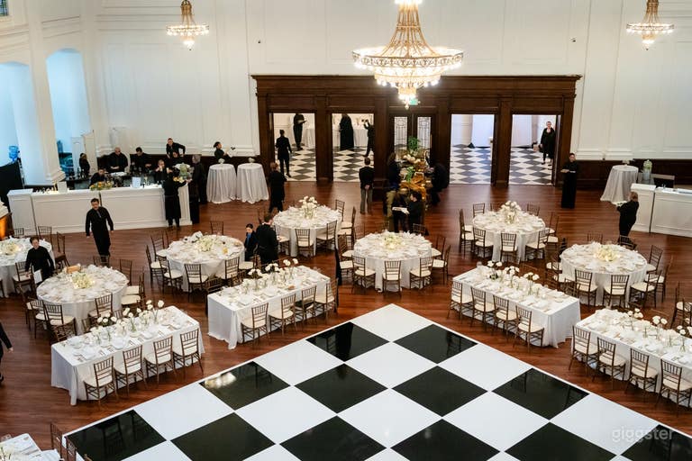  Overhead of black and white dance floor with surrounding reception tables 