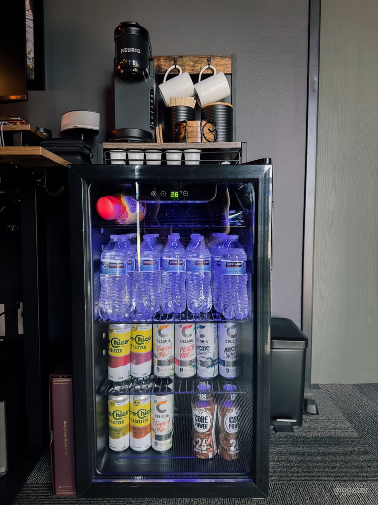  Amenity station with fully stocked mini fridge as well as coffee maker. 