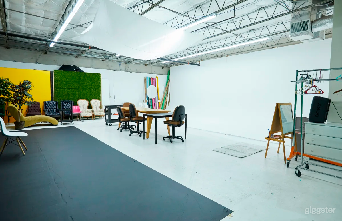 Multiple chairs, tables, moving wall, and seamless paper backdrops