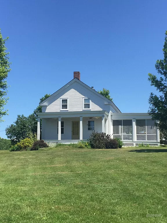 White House with Glass Porch in Serene Haven Photo 1