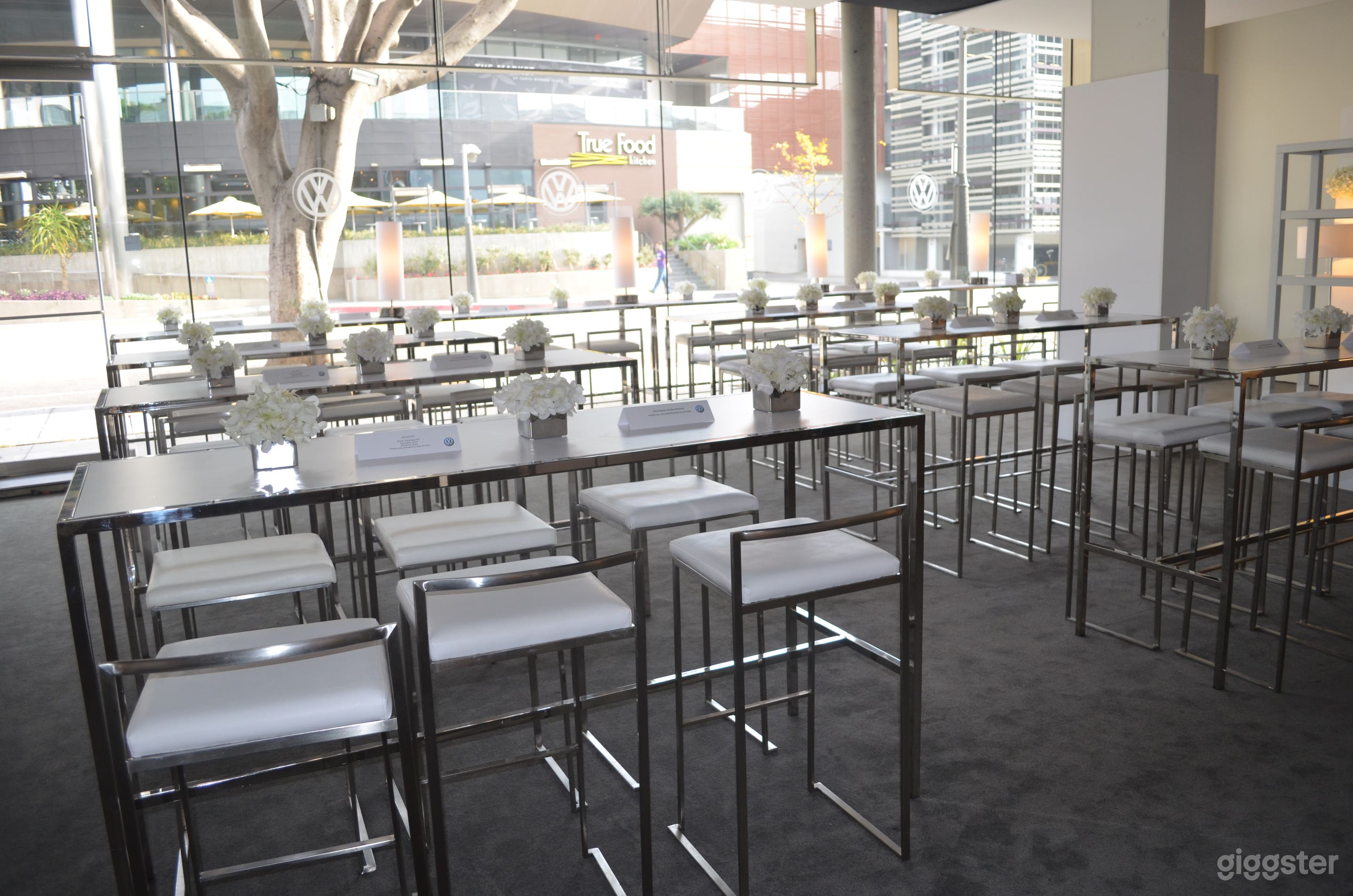 Custom chairs/tables extra. 
Space now features frosted glass for added privacy across the street from Santa Monica Place. 