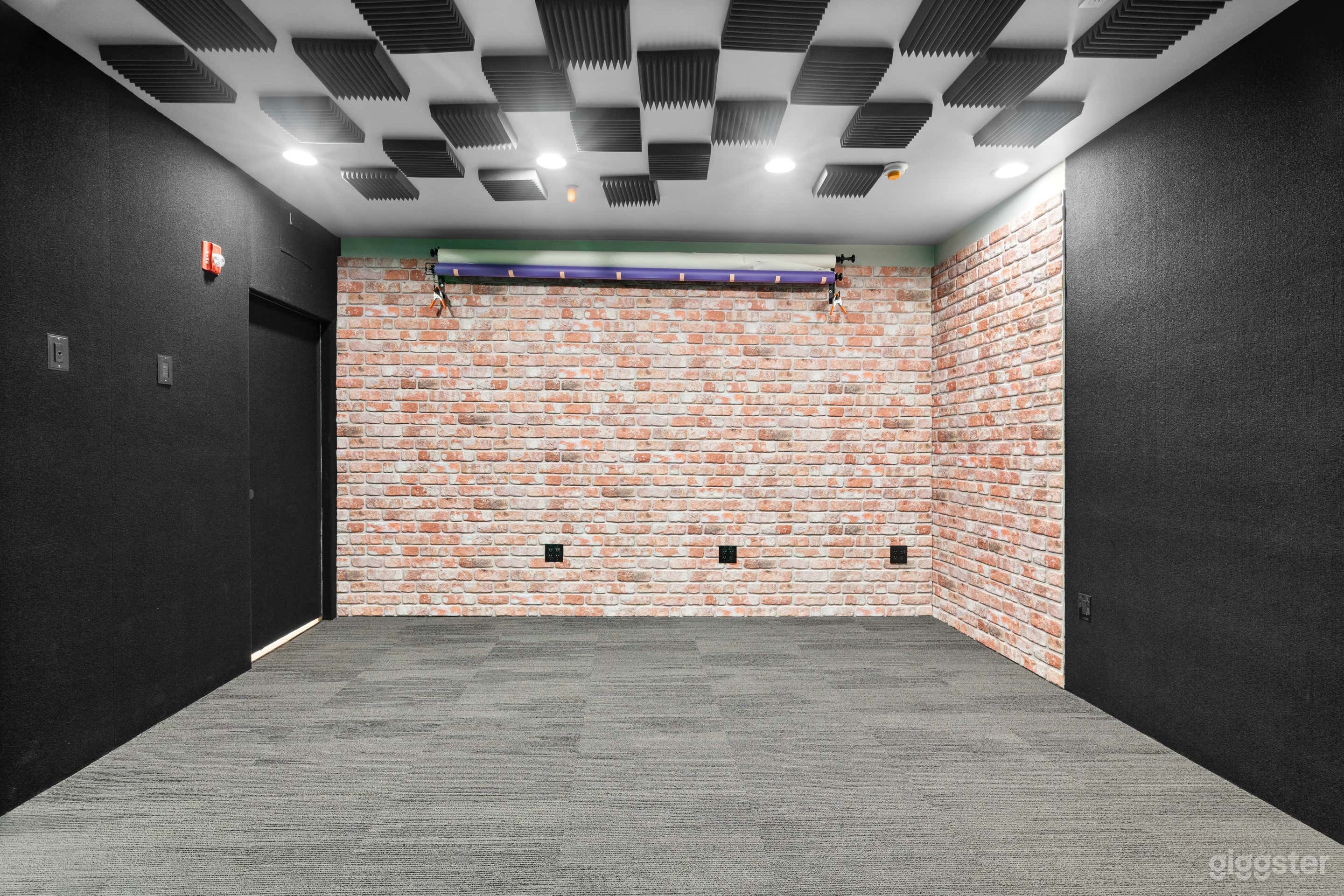 Brick wall with paper roll holder