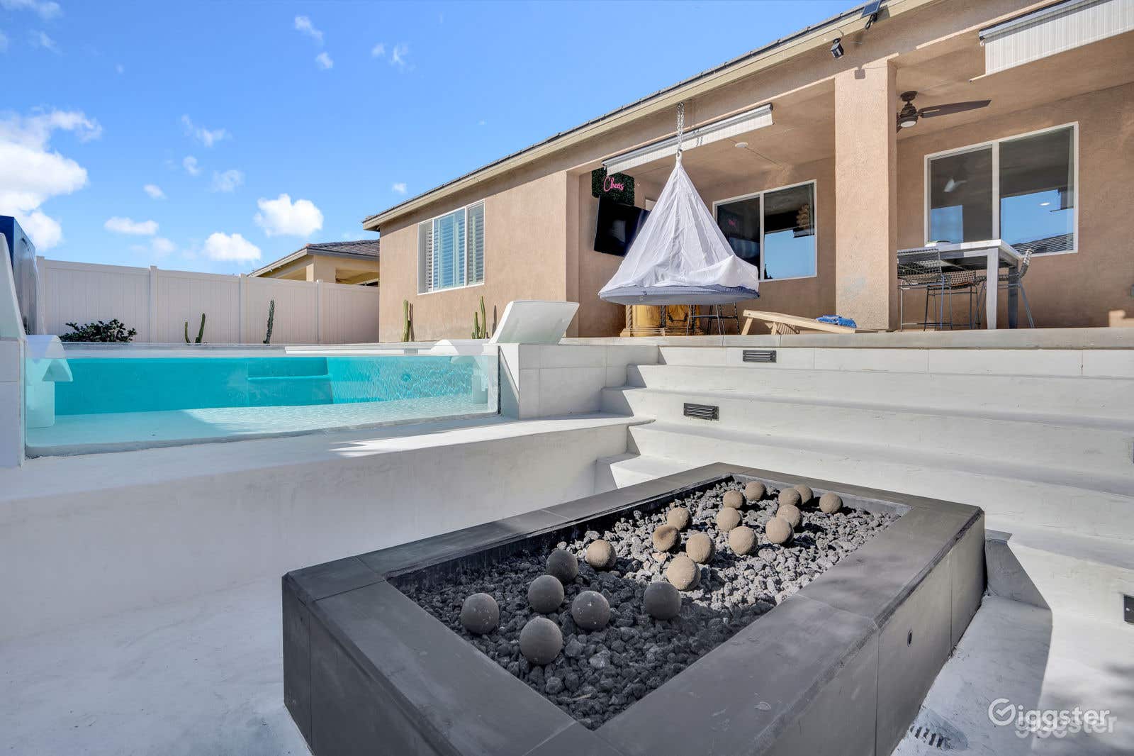 Chill out in the sunken fire pit area or peek through the glass pool to witness all the fun!