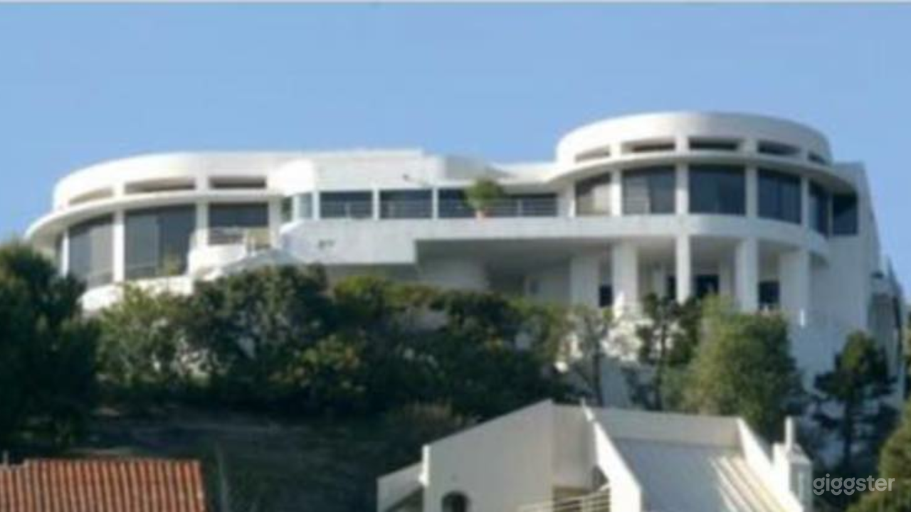 Hill top mansion.  Exterior View of back of house from below. 