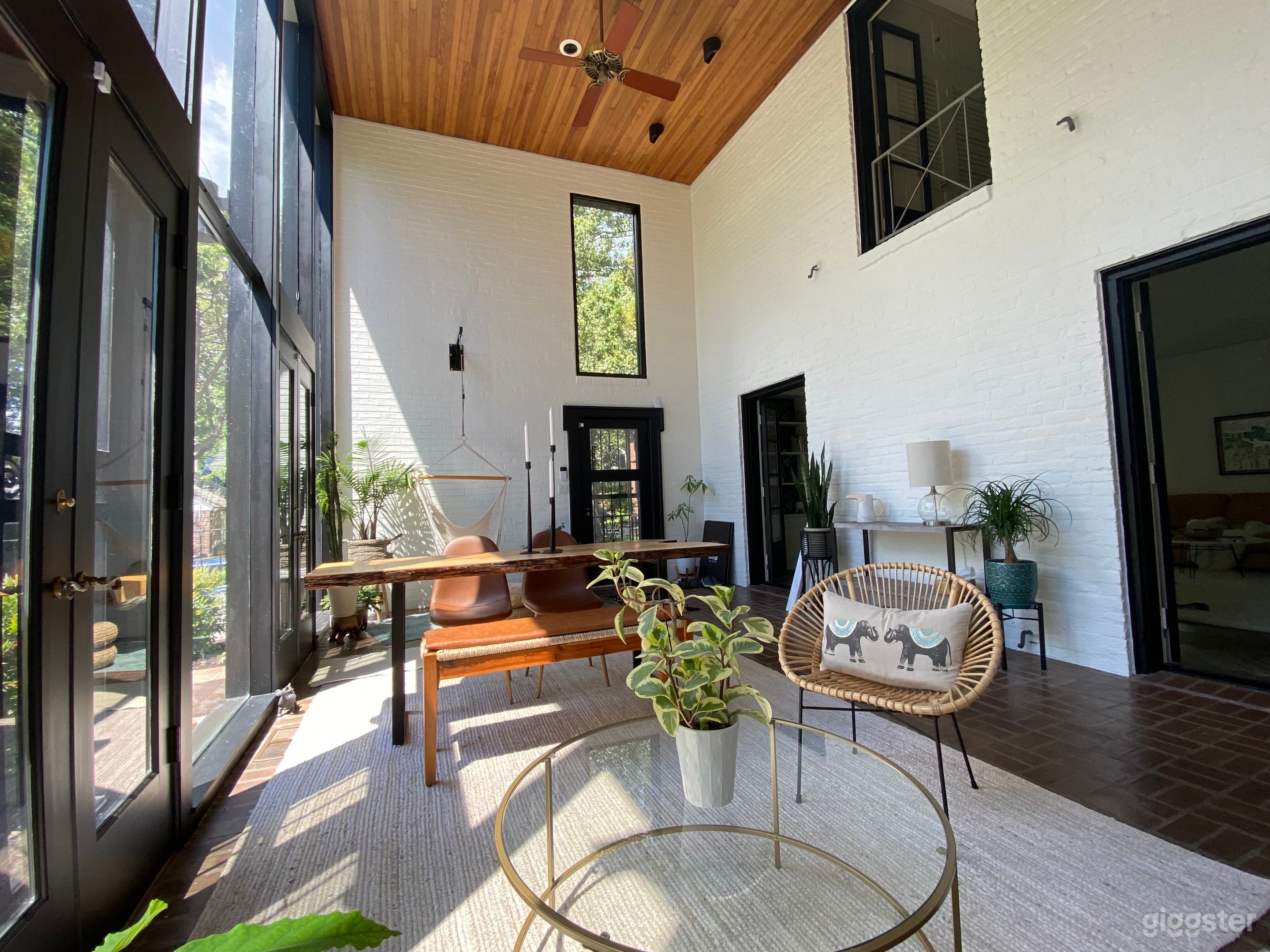 Two story south facing atrium with wall of glass  Photo 3