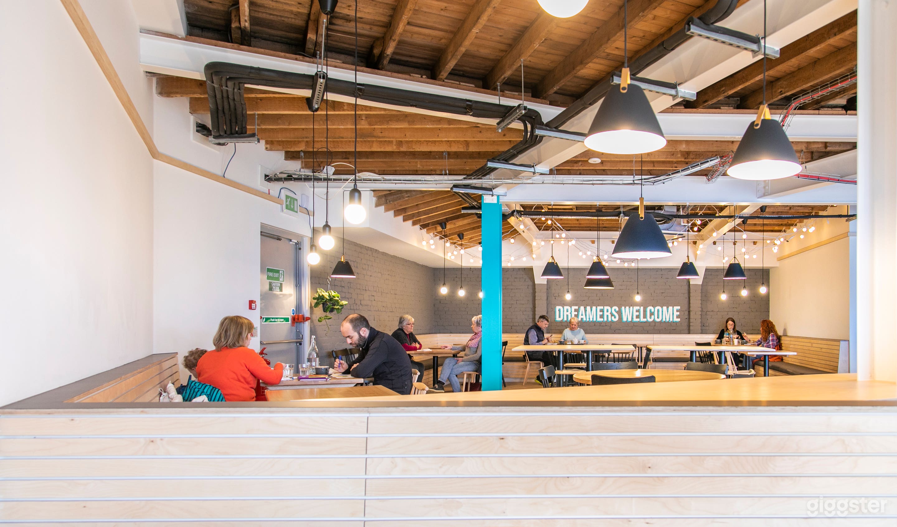 Looking toward the back of the cafe and the Dreamers Welcome signwritten wall