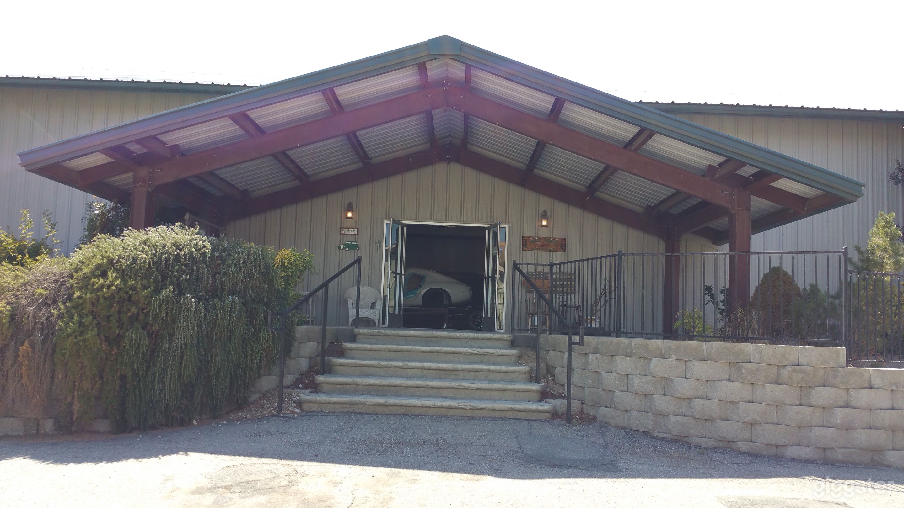 Covered patio area that leads to the double doored entance.