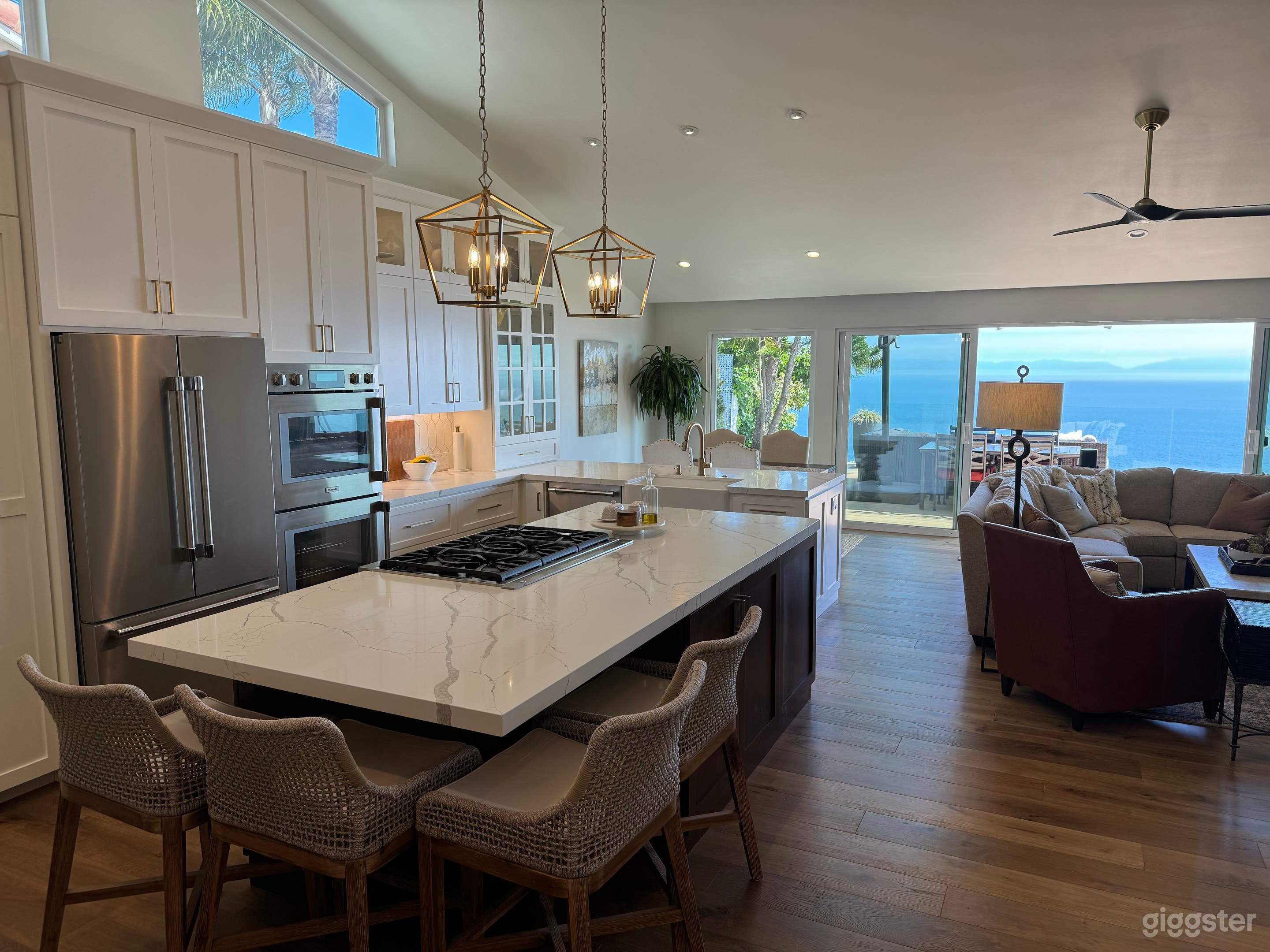 Open concept kitchen with high-end stainless appliances and 9' island with 6 burner gas stove.  Perfect for cooking shows! 