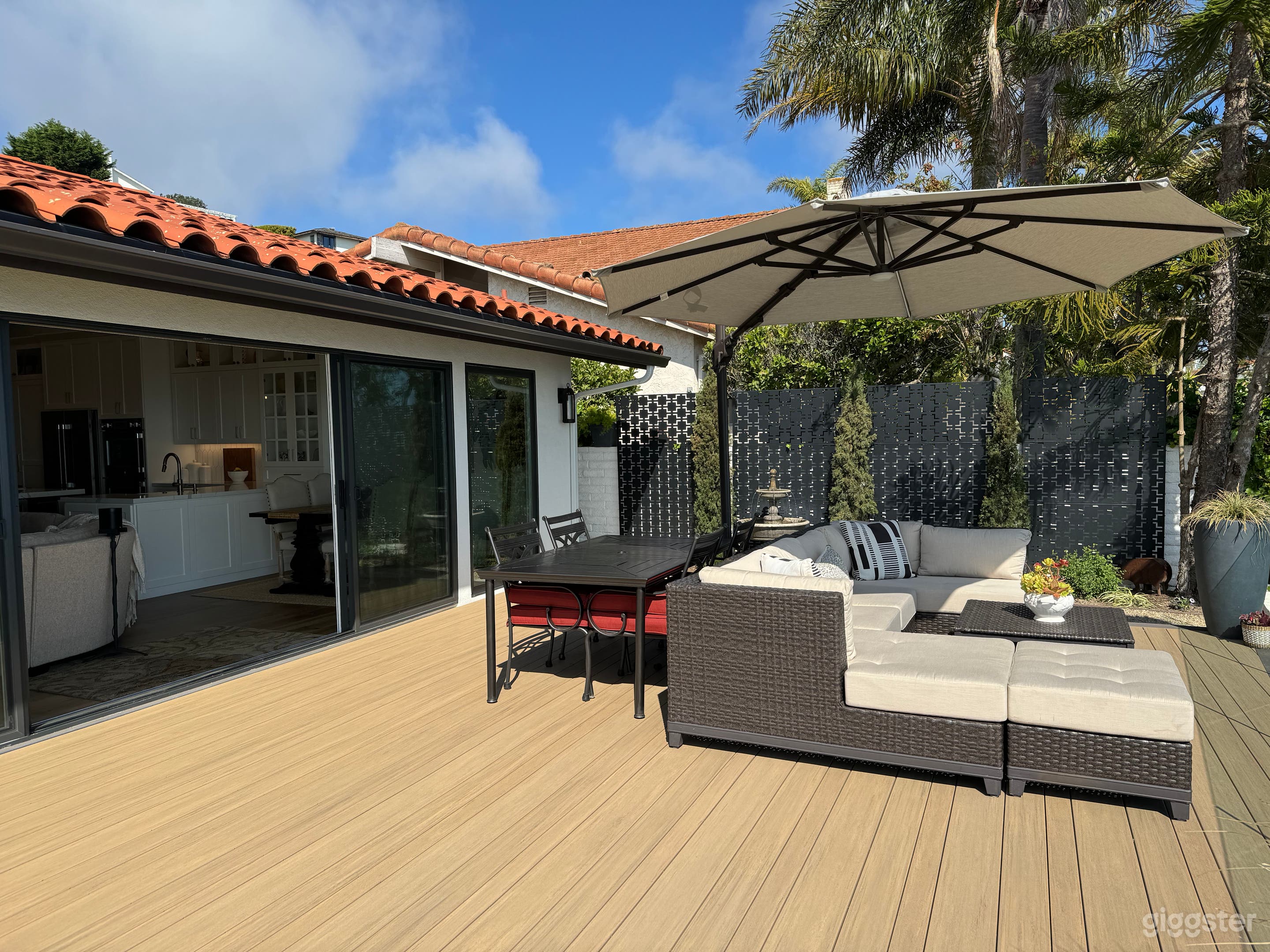 Large 20'x20' composite deck is on the same level as the house for easy flow in and out. Features a clear glass railing for unobstructed views of the ocean. 