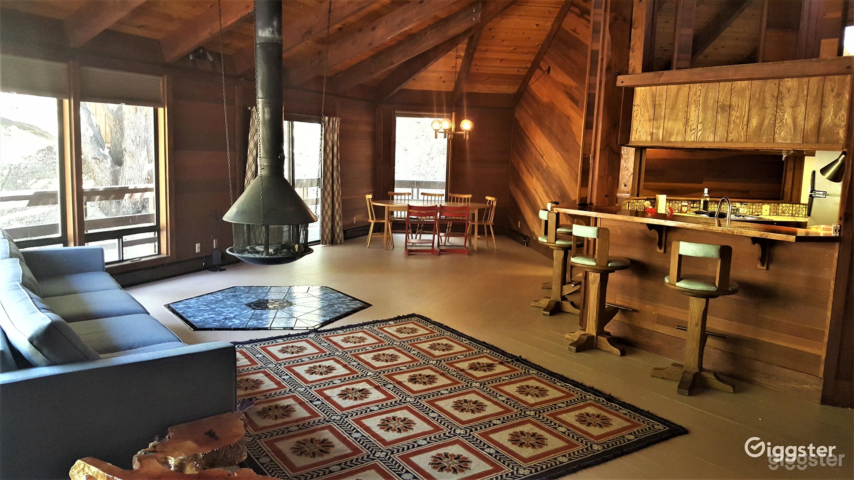 Working fireplace that hangs from vaulted ceilings.  Windows all around living room. The entire home is an octagon and is built around the kitchen in the middle. 