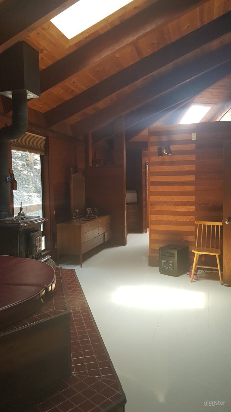  Hallway in Master Bedroom- POV is from the bed. There is a double sink, functional glassed-in shower, and toilet room. Additionally, the wall with the wood stripes you see here is an entry way to a &quot;secret&quot; loft that is glassed in an overlooks the house. 