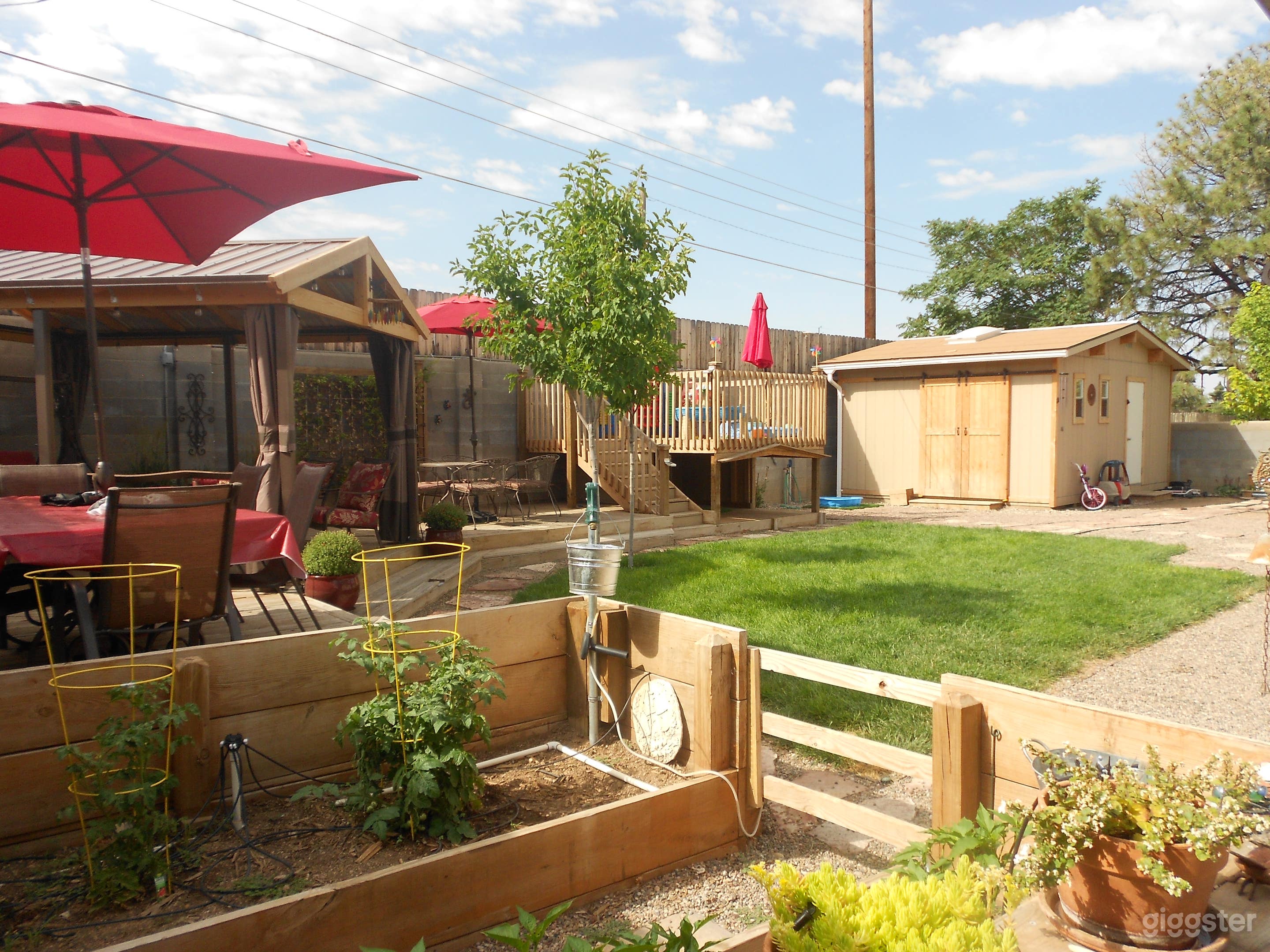 Back yard showing bonus workshop/playhouse.