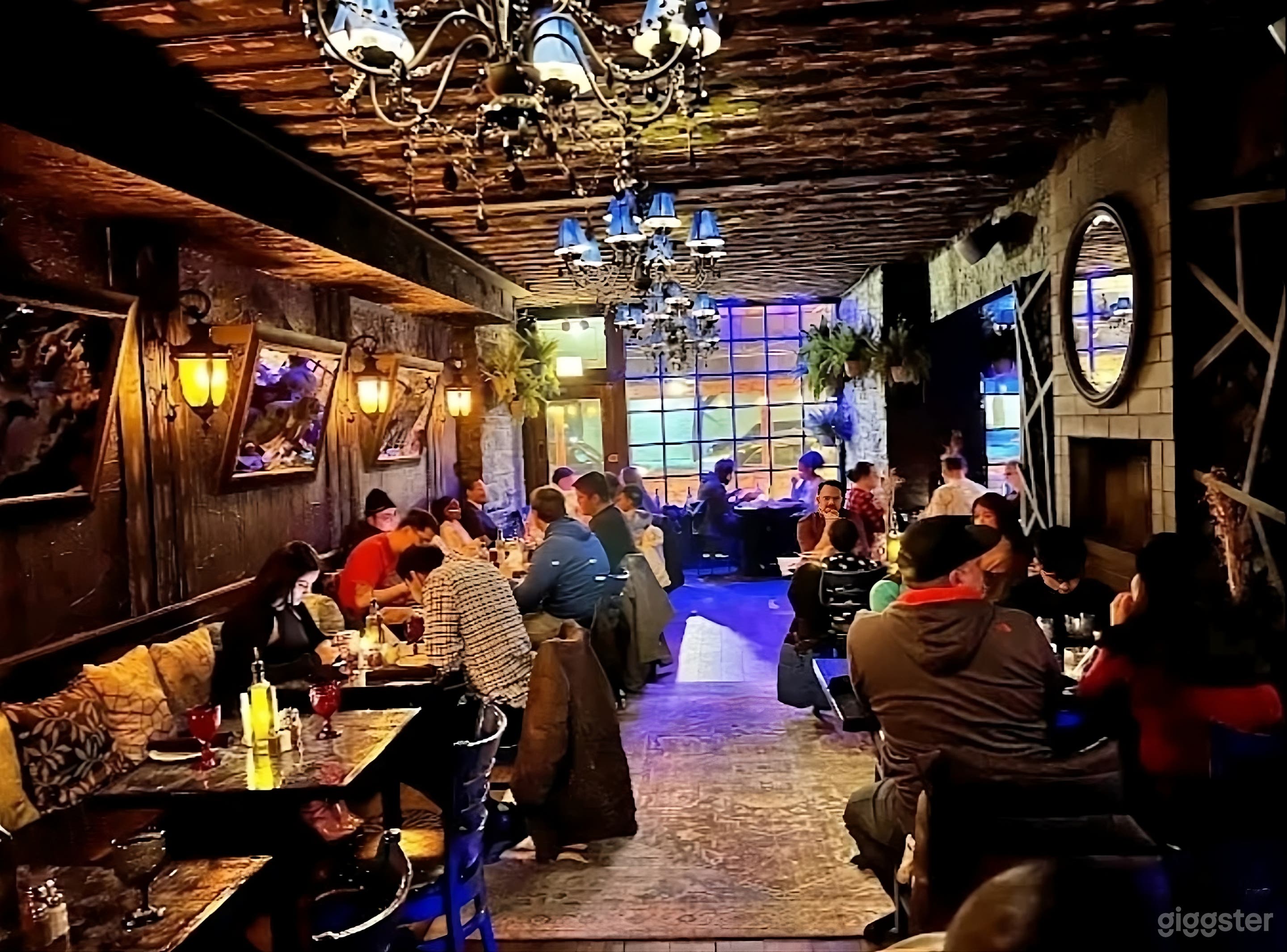 Dark-themed Event Space with Bar Photo 3