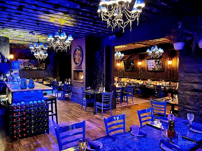 Dark-themed Event Space with Bar Photo 1