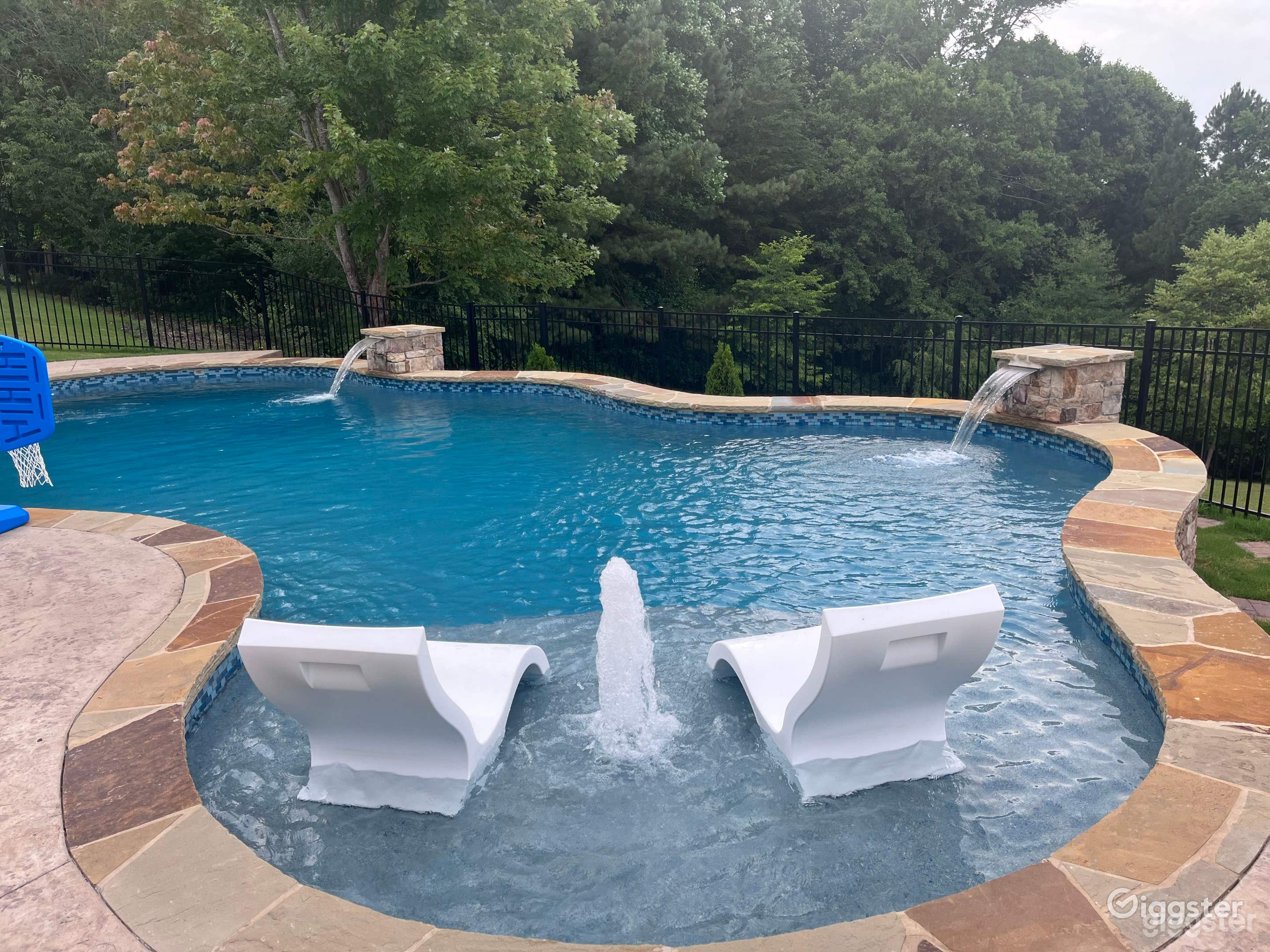 An outdoor pool in a serene oasis  Photo 2