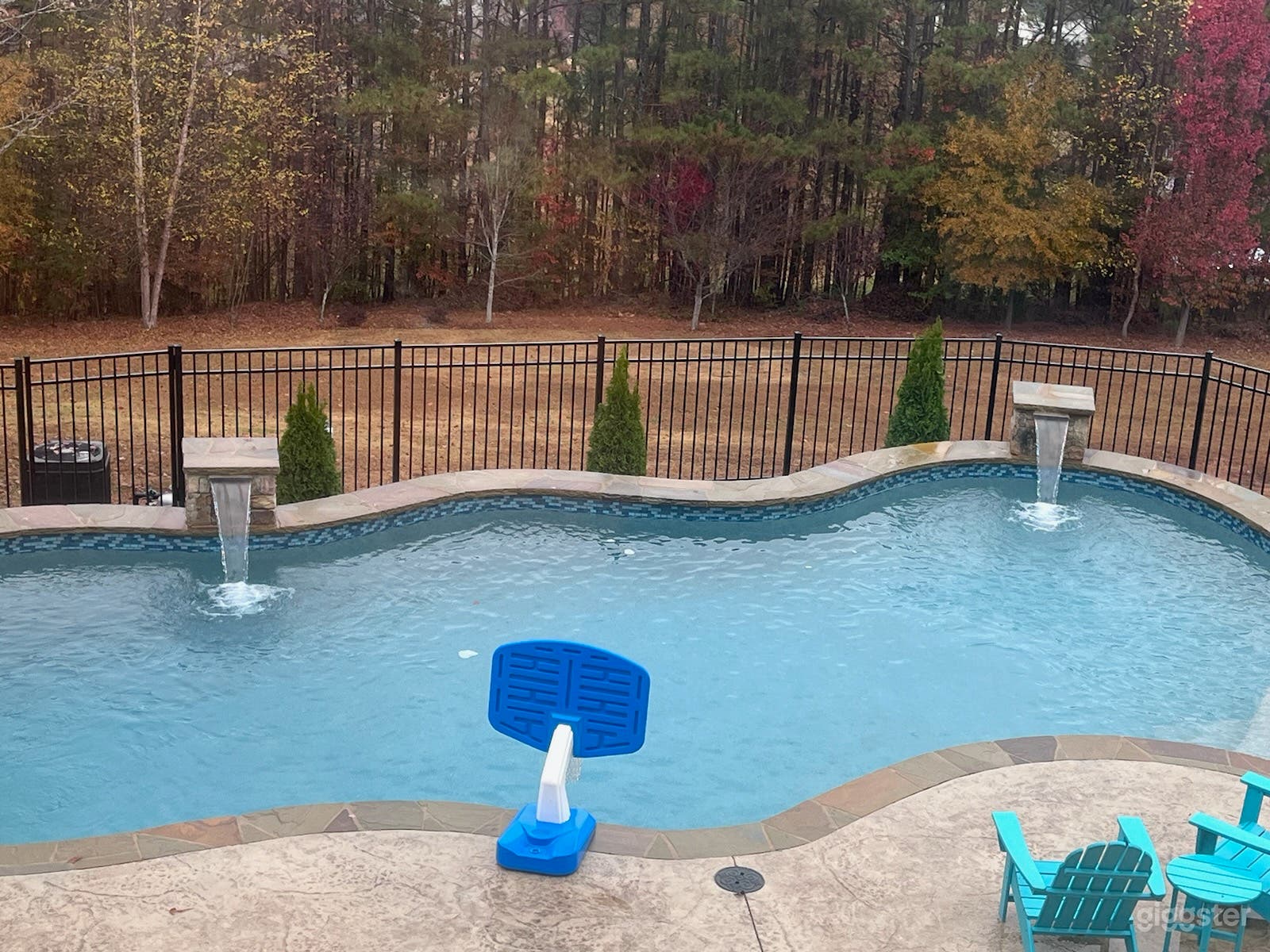 An outdoor pool in a serene oasis  Photo 3