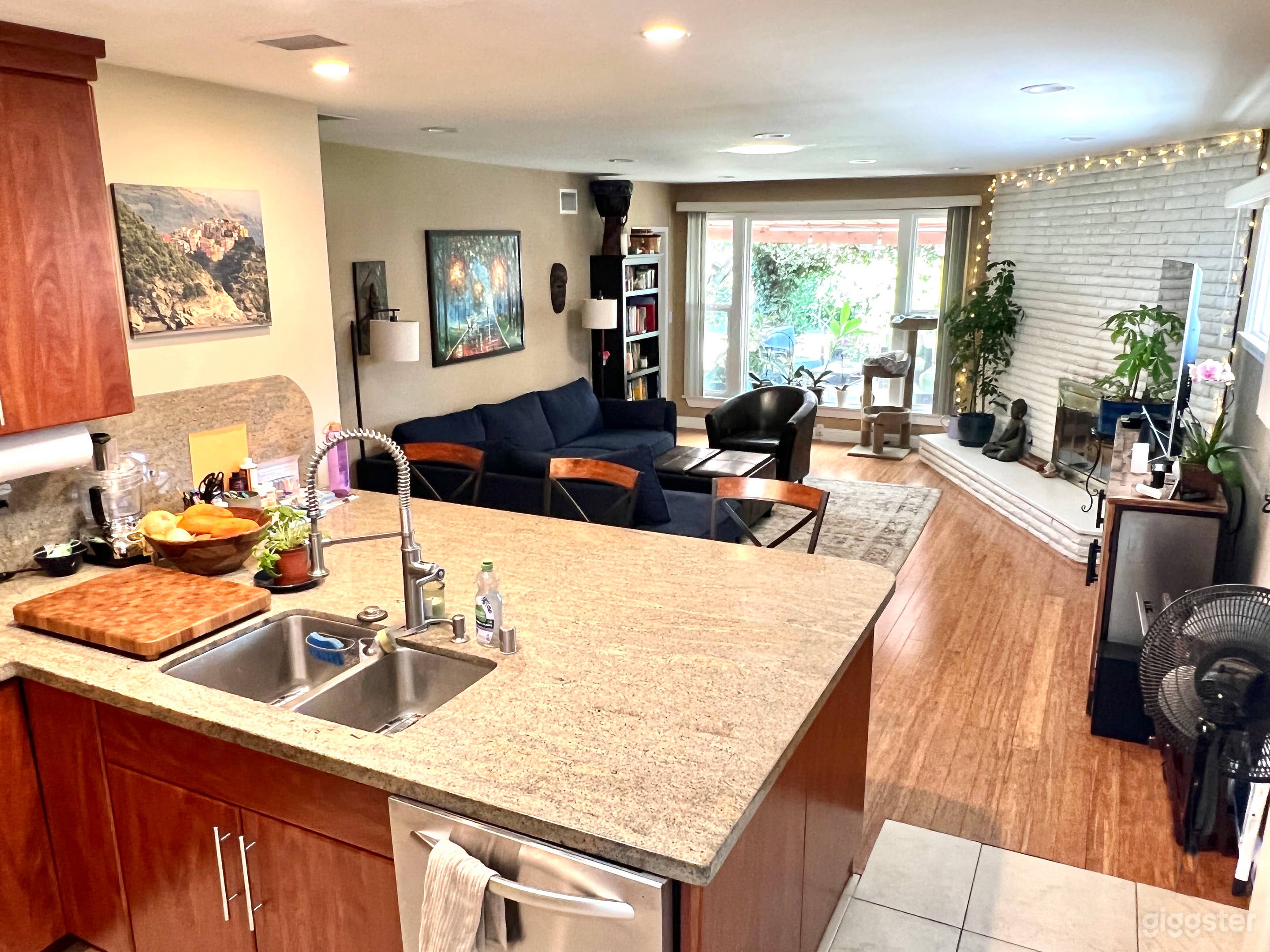 Open floor plan, kitchen island looks out into family room.