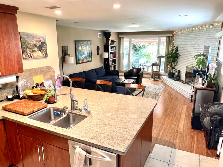 Open floor plan, kitchen island looks out into family room. 