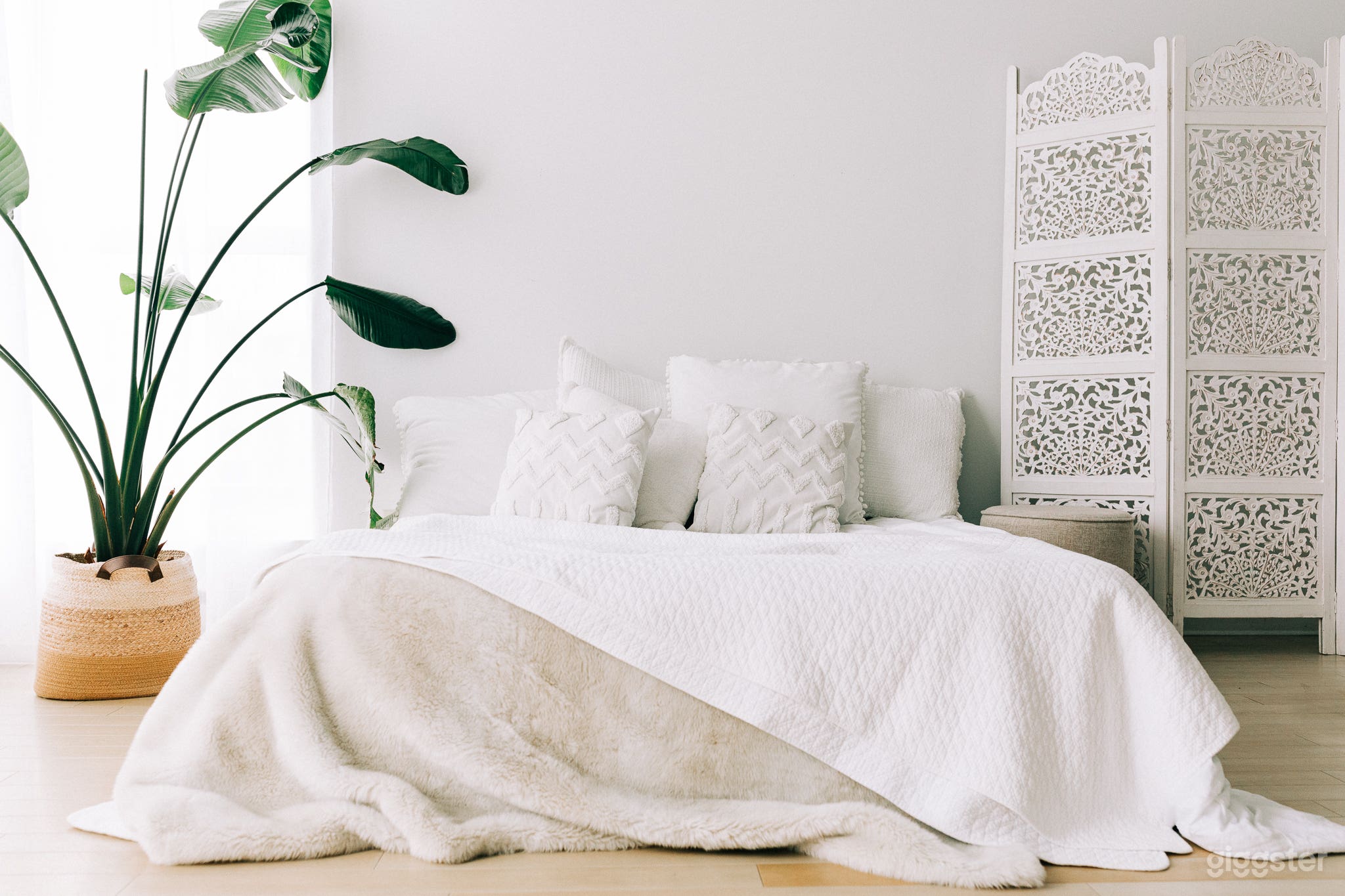 Self-inflating queen air mattress, complete with all white linens.