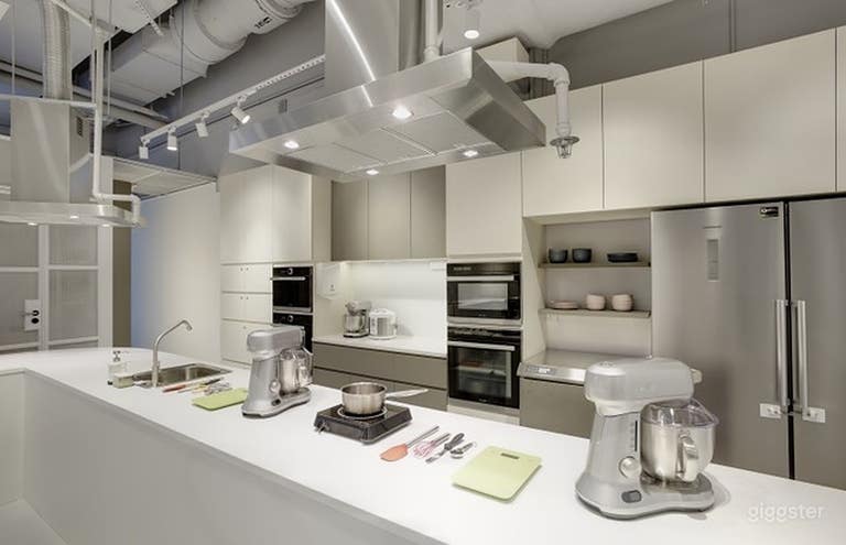 Clean and white fully-equipped kitchen space.  Baking and cooking welcome. 