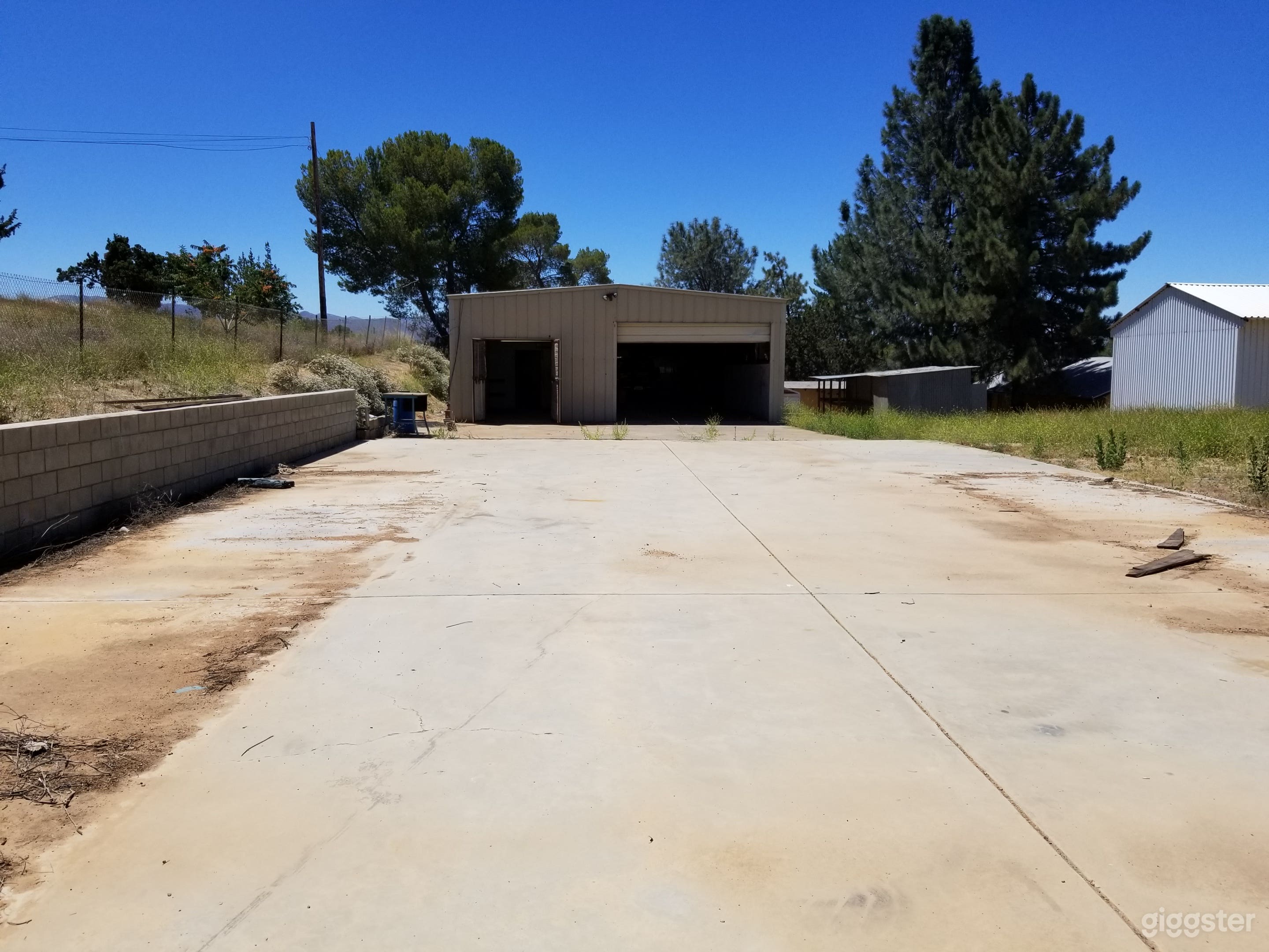  100' x 40' wide cement area if front of building