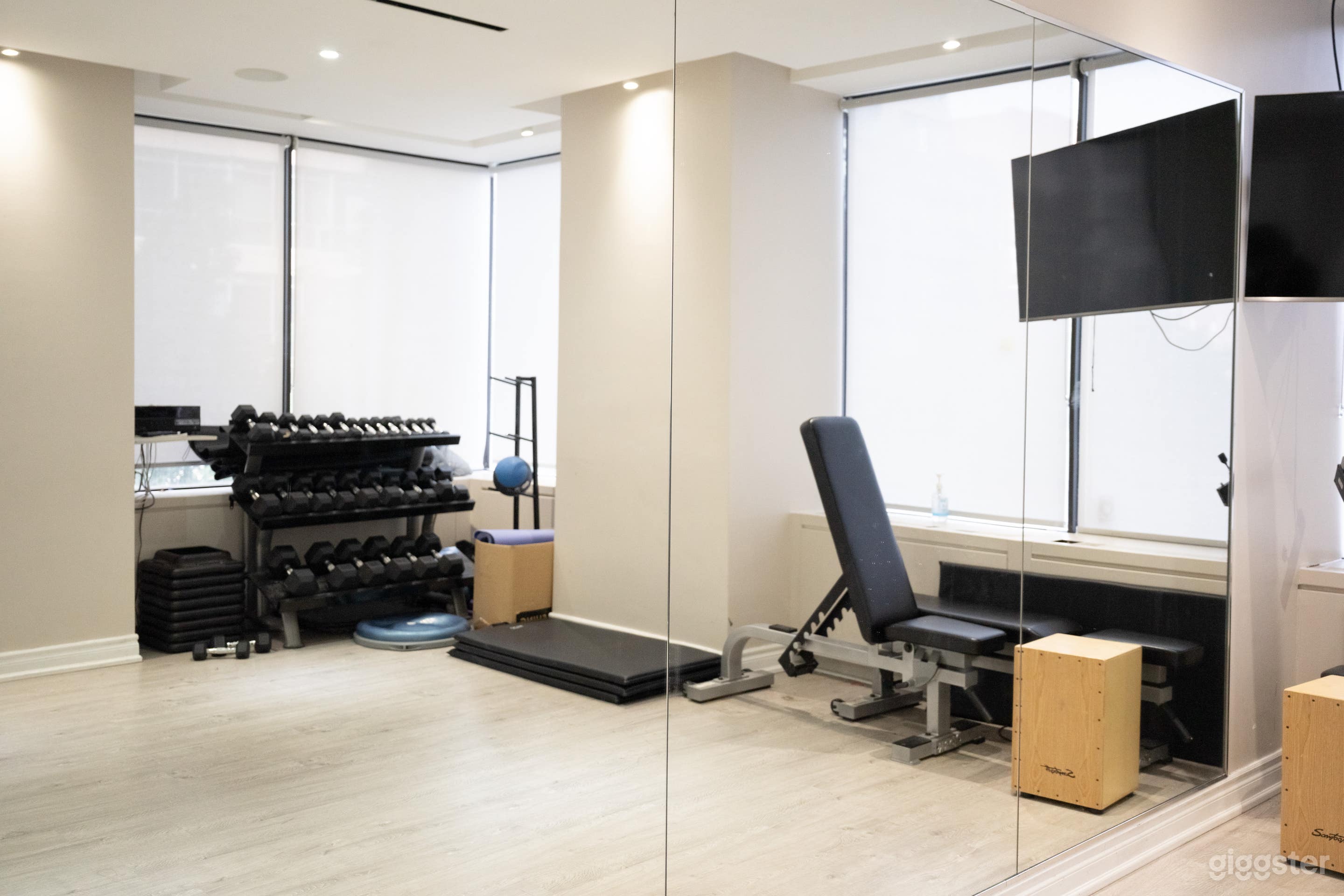 Basic weight lifting equipment and yoga mats for fitness are available at this gym studio