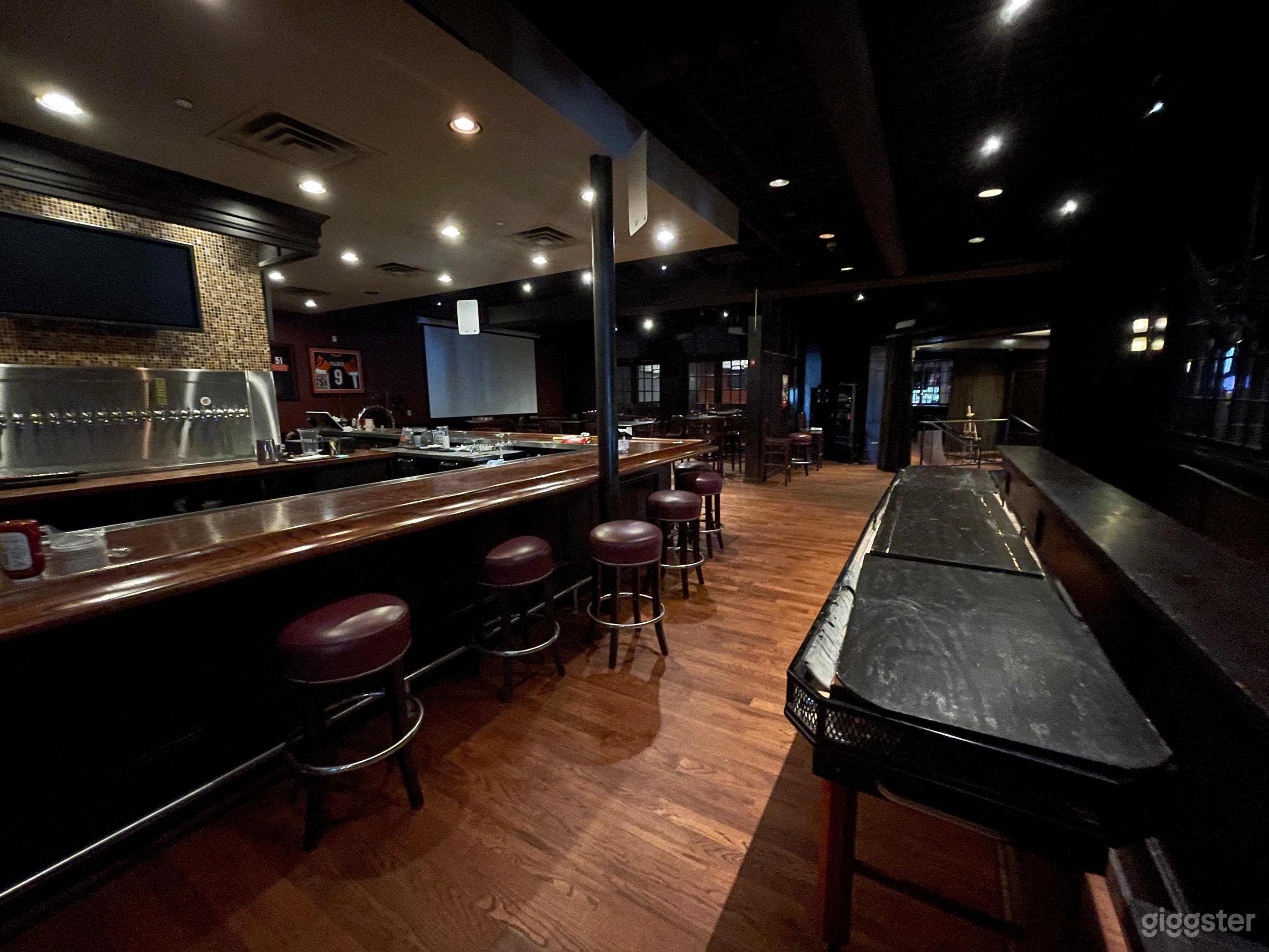 Private bar; bar seating for 20, projector screen and seat for 50