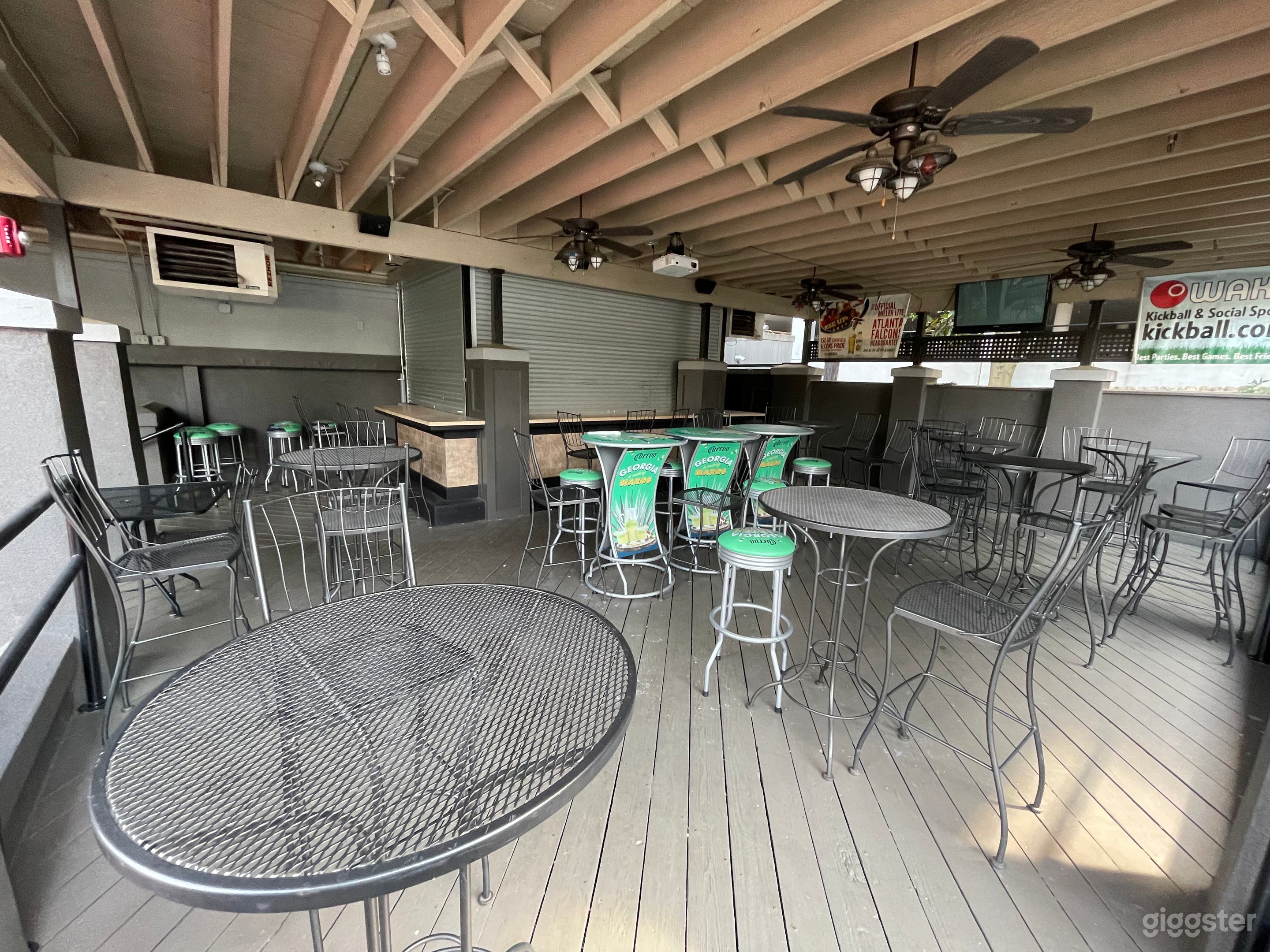 Patio bar; extensive space with a projector and pub tables and an 8 seat bar.