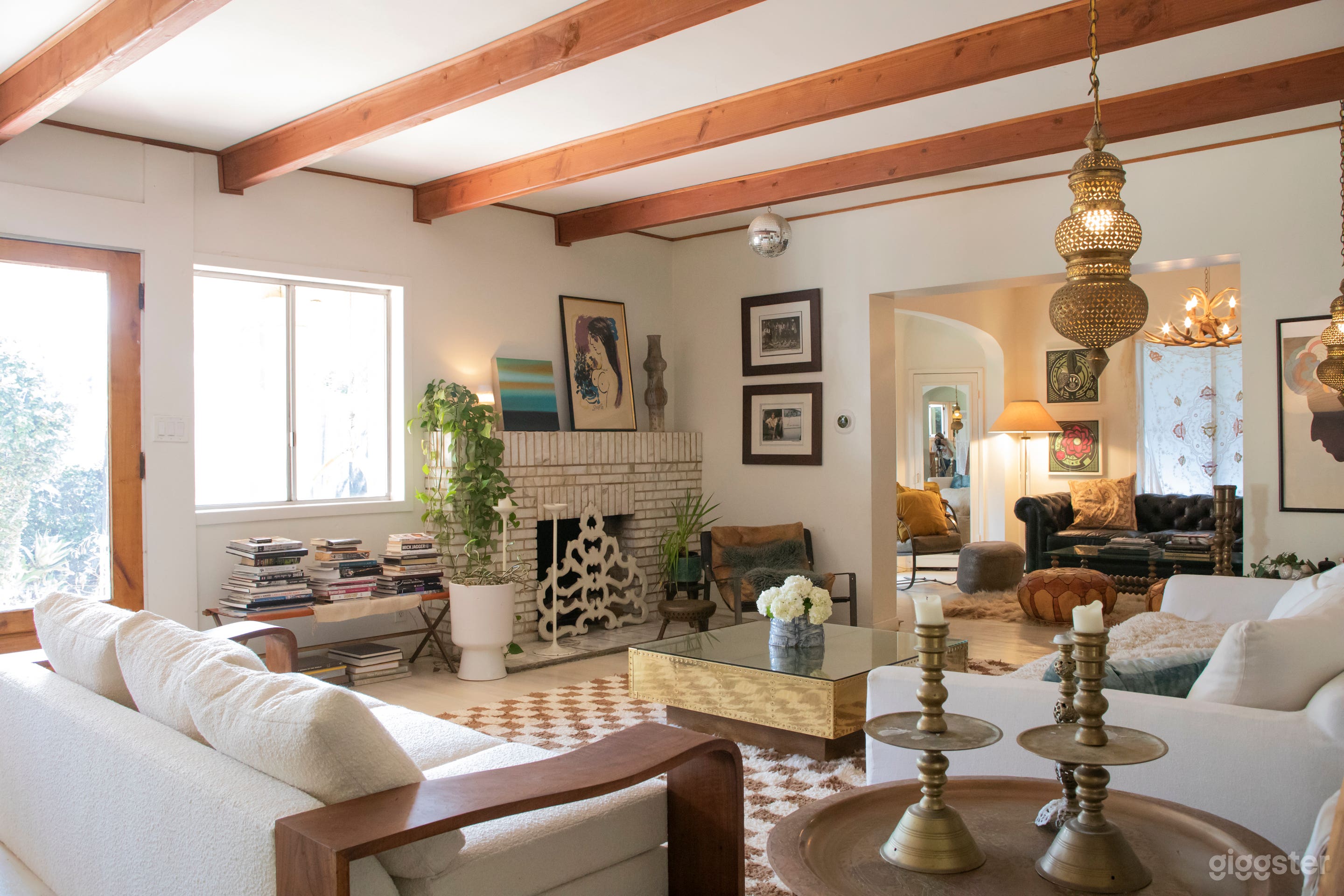 Living room and adjoining tv room with 2 fireplaces