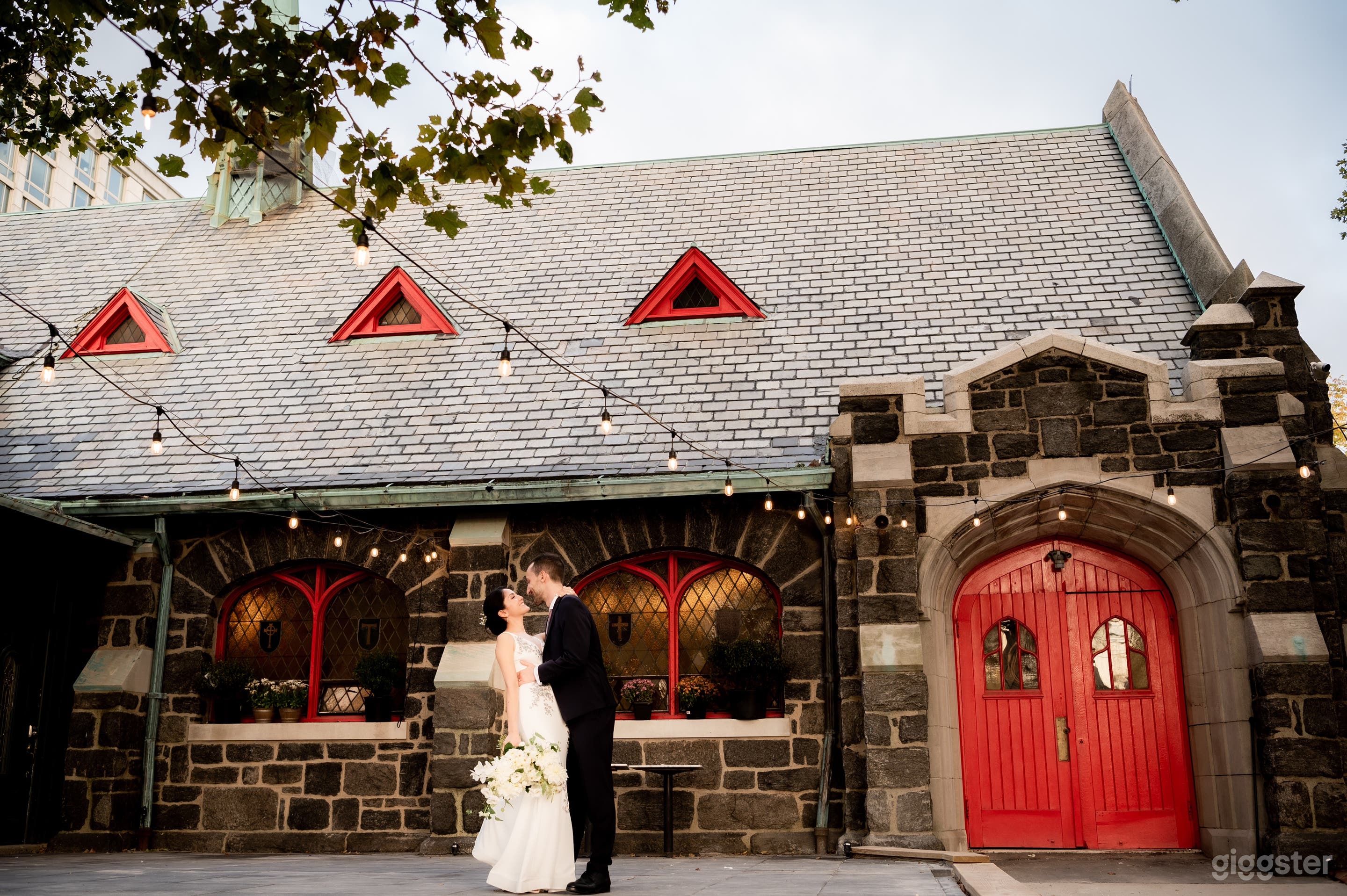 Close up of church front.  Original vestibule coat room inside of red main doors before entering main indoor space