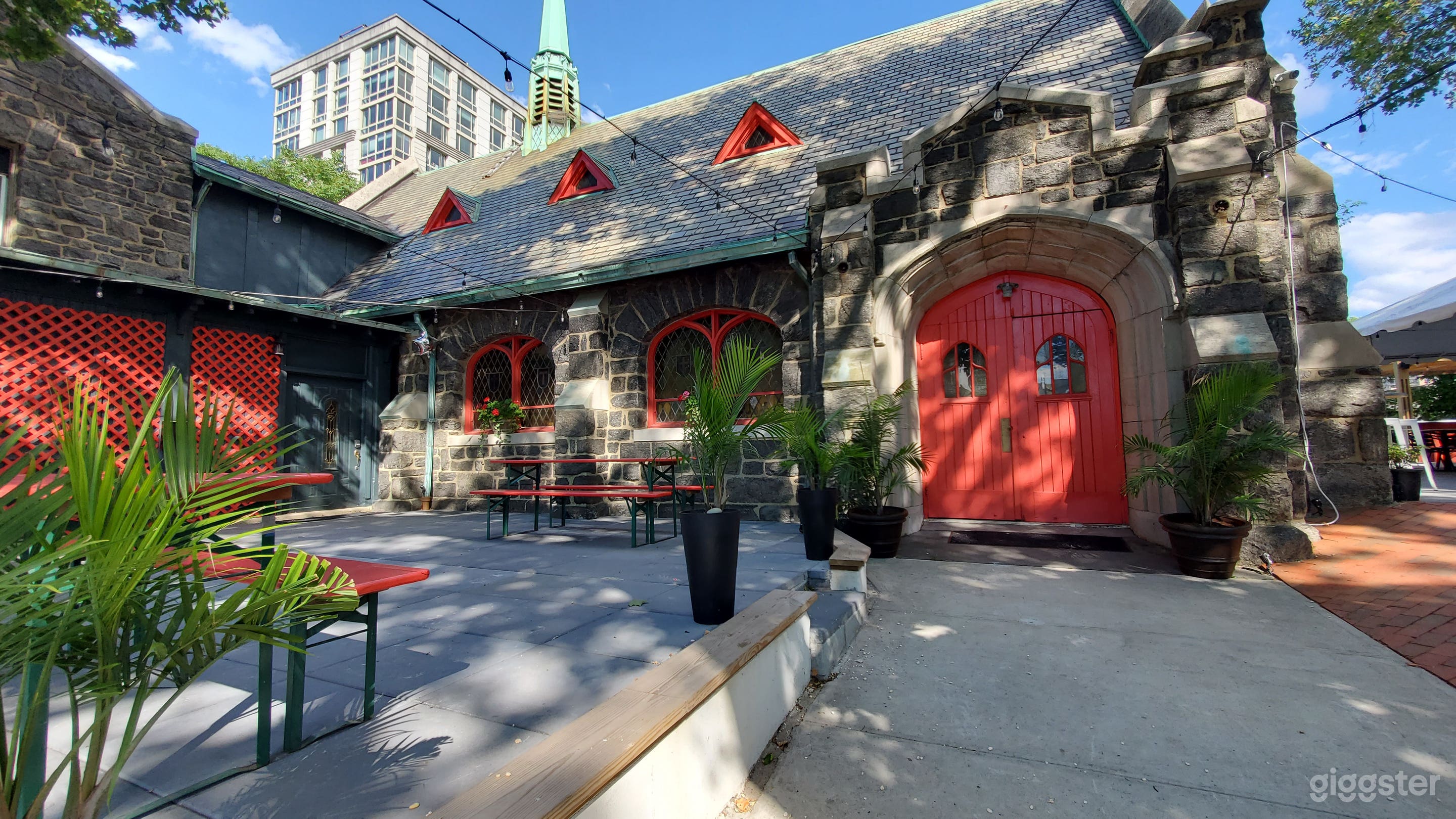 Front view of property; red wooden main doors are to church space