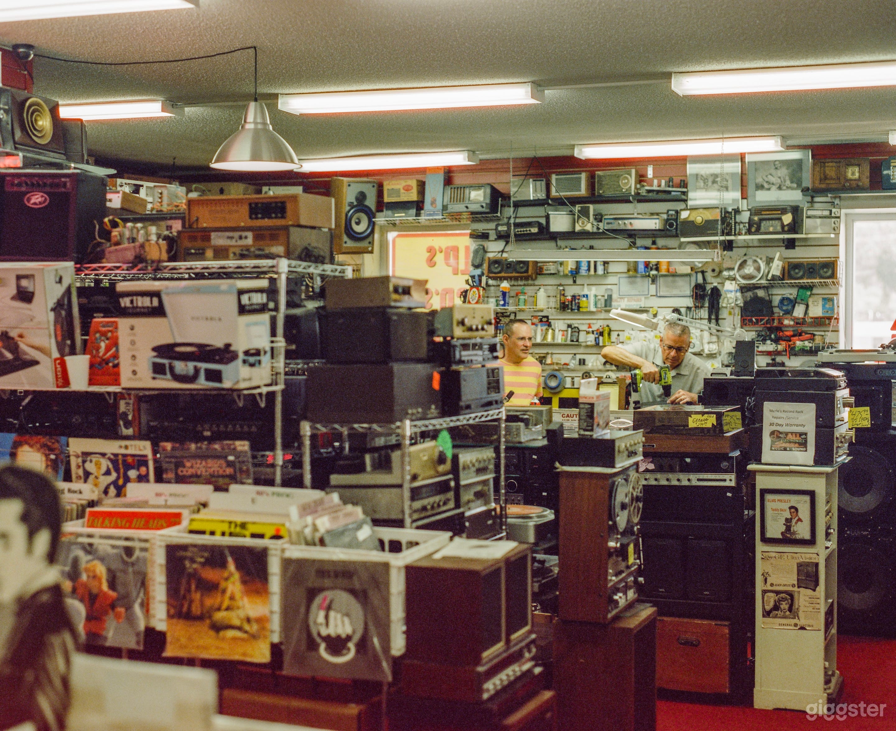 Vintage record shop with wall-to-wall memorabilia Photo 1