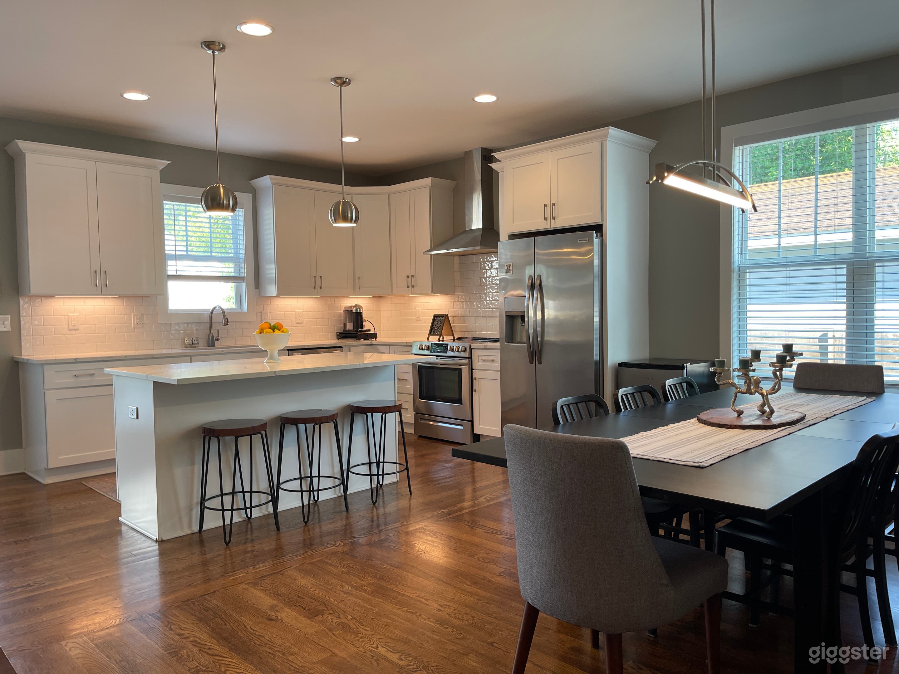 Spacious & timeless all-white kitchen with ample counter space and natural light.