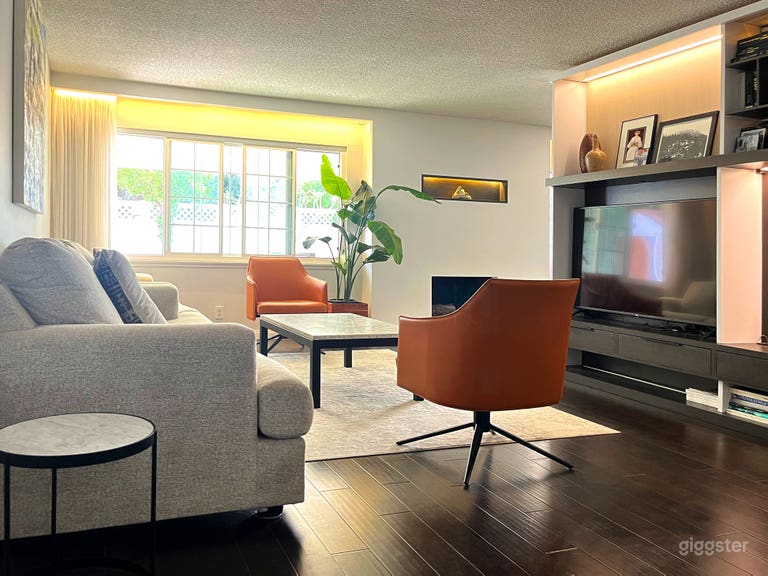  Contemporary, open concept livingroom with large modern sofa set. Sheer curtains, modern, lighted fireplace 