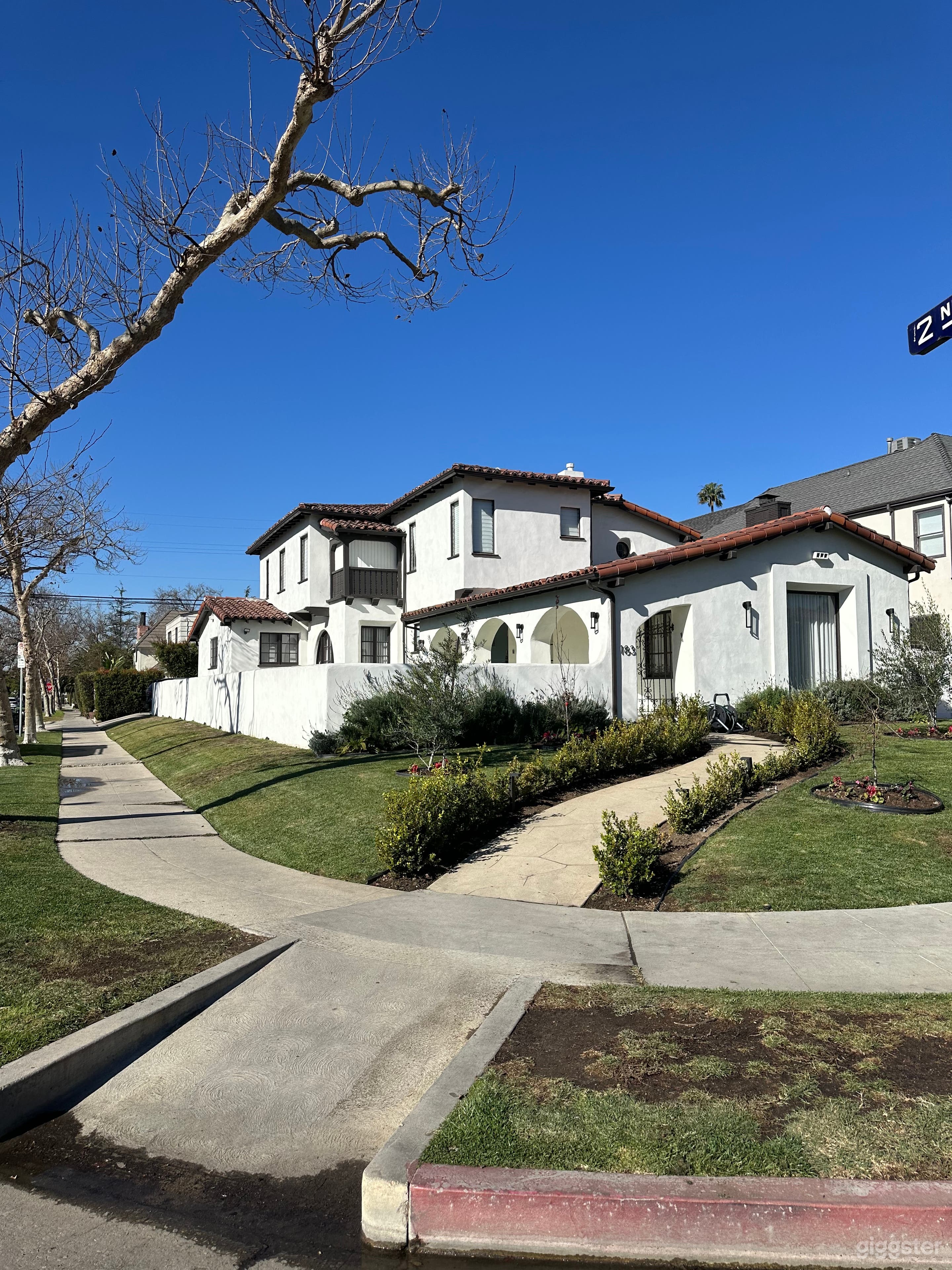 Large Spanish Revival Home (Lush Landscaping) Photo 1